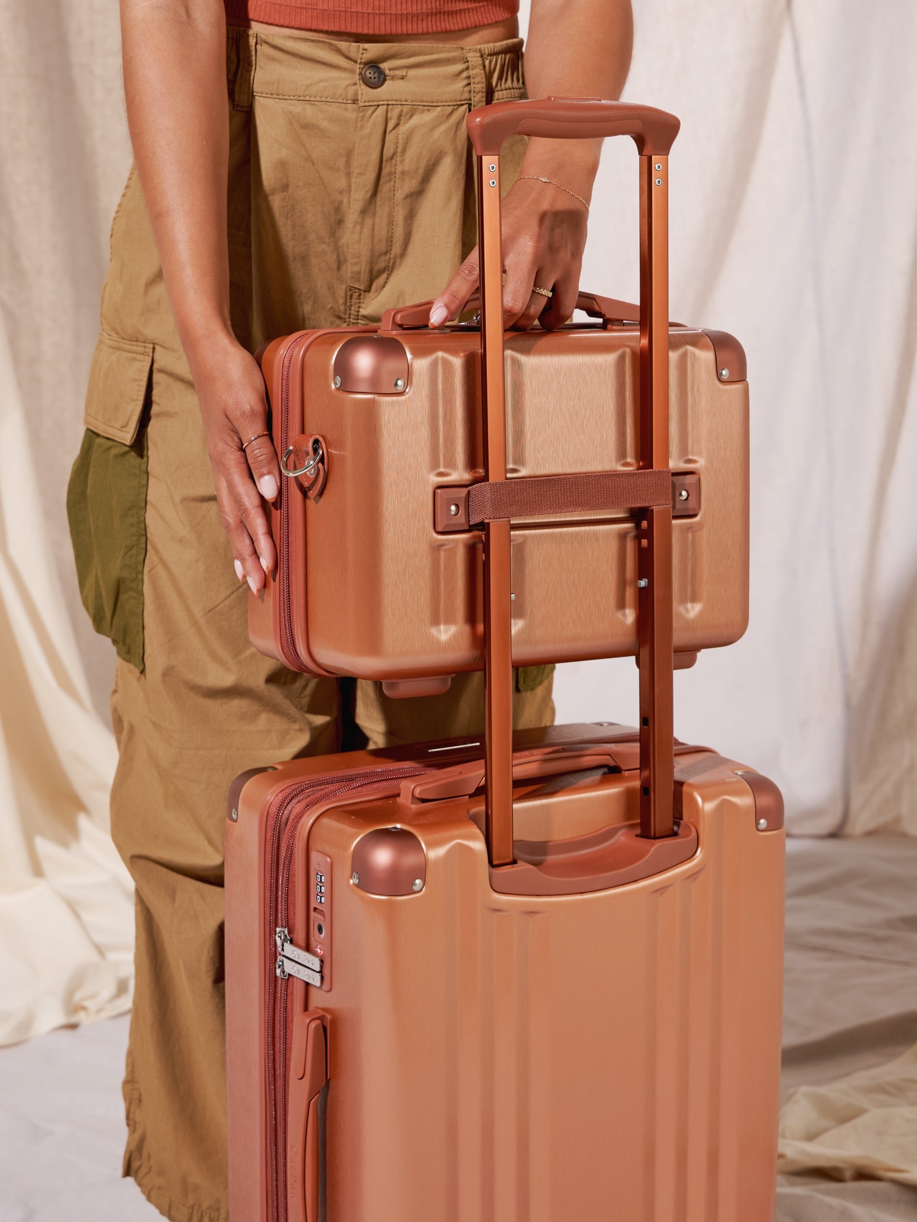 CALPAK Ambeur makeup case with trolley sleeve in brown copper