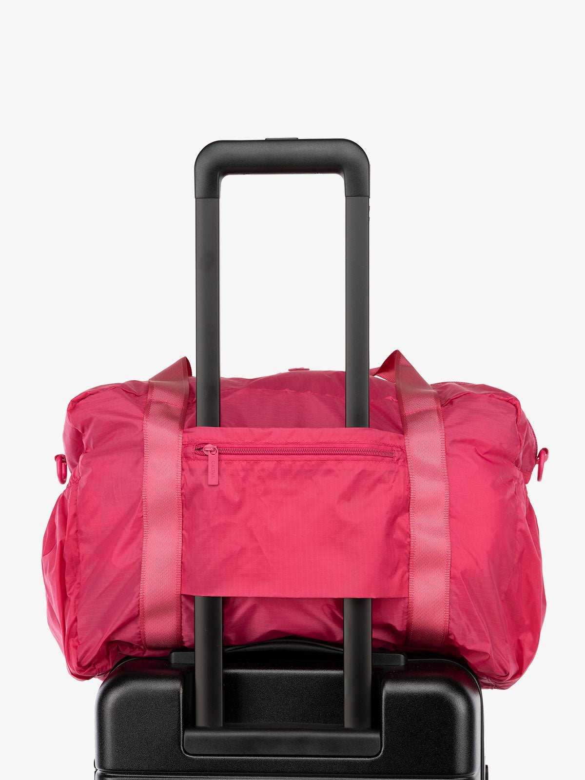 CALPAK Compakt nylon duffle bag with trolley sleeve in pink