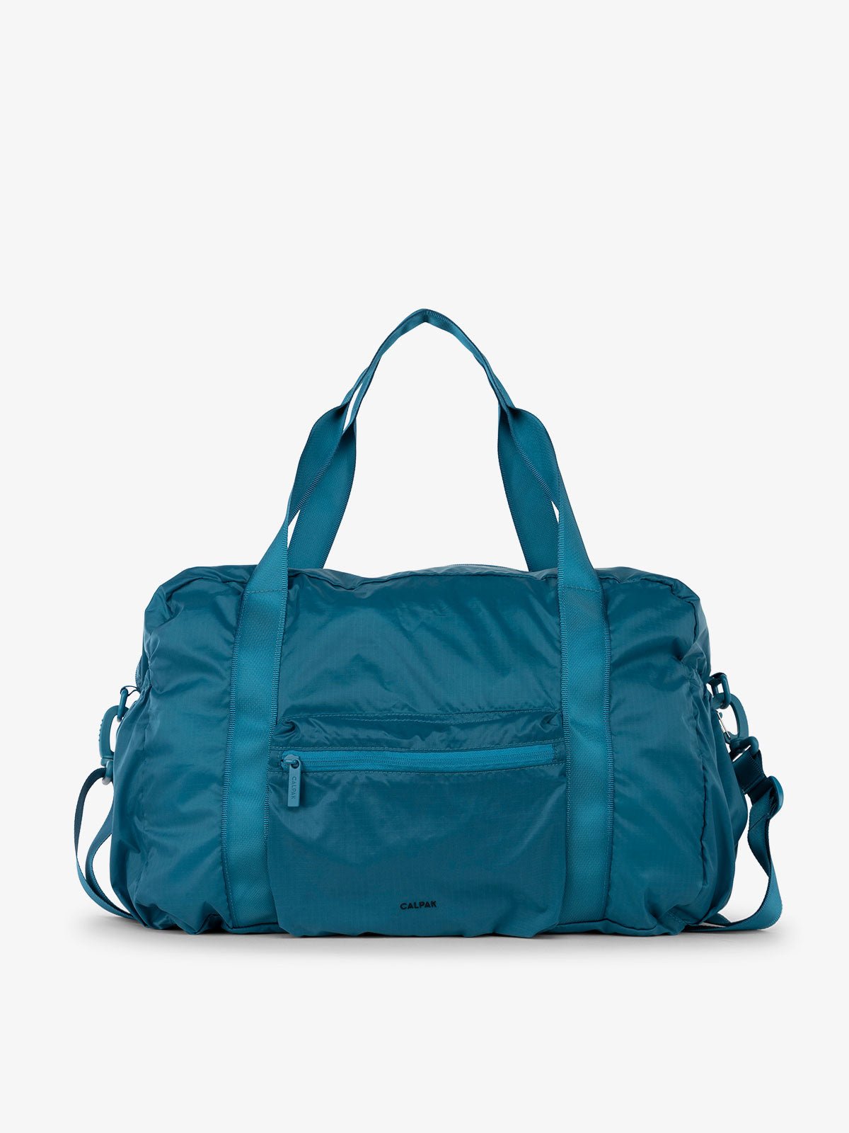 CALPAK Compakt duffel bag with removable crossbody strap and water resistant fabric in lagoon