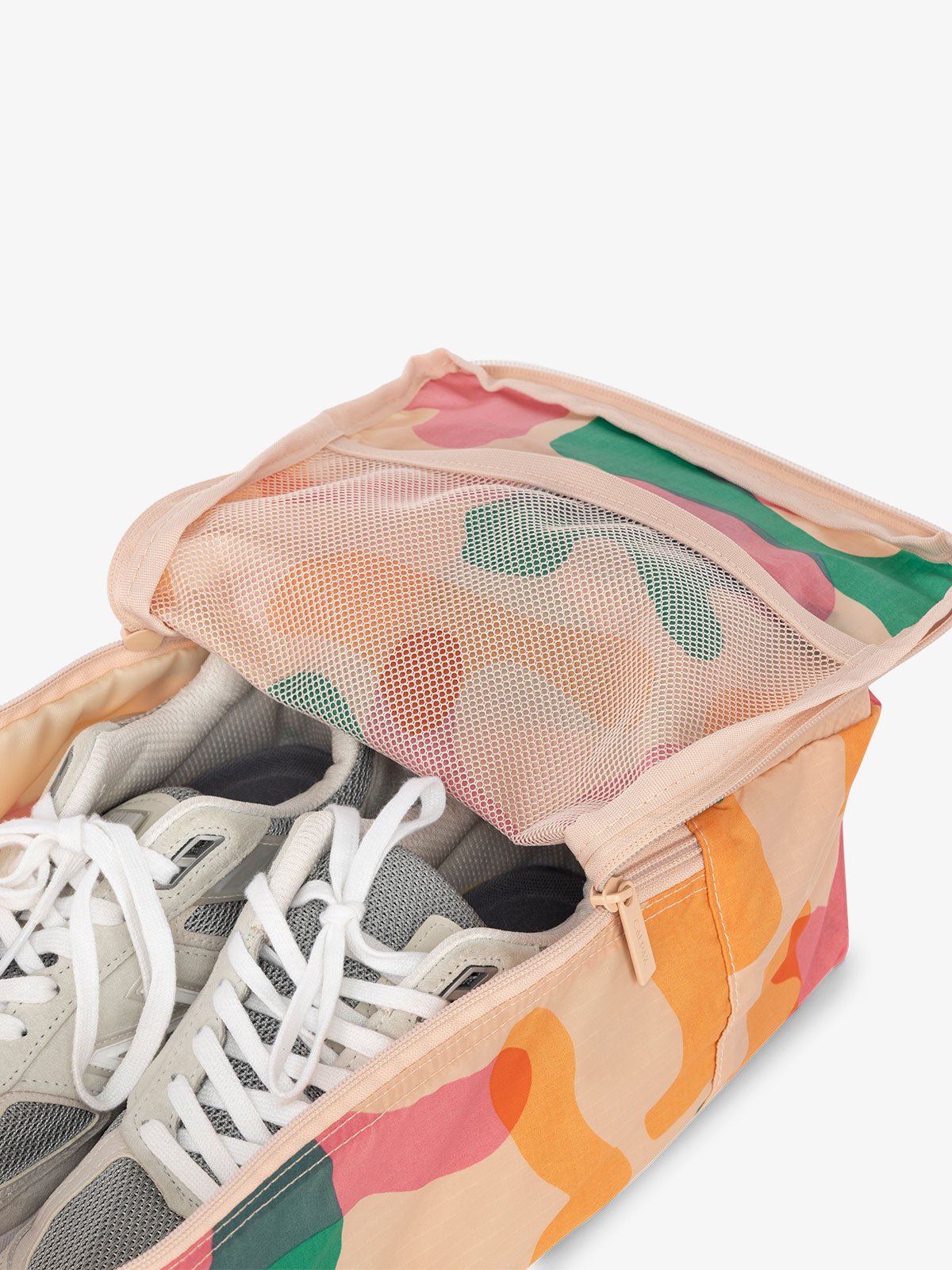 CALPAK Compakt zippered shoe travel bag with mesh pocket in pink and green abstract print