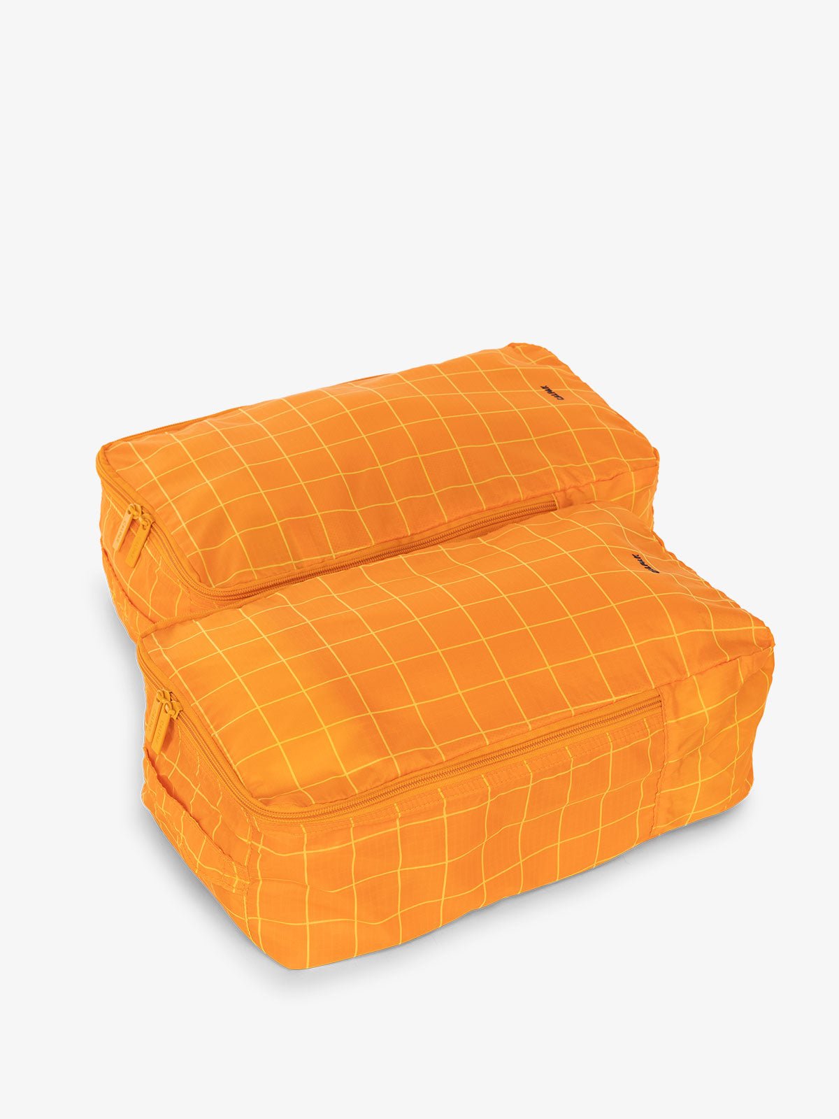 CALPAK Compakt shoe bag set in orange grid