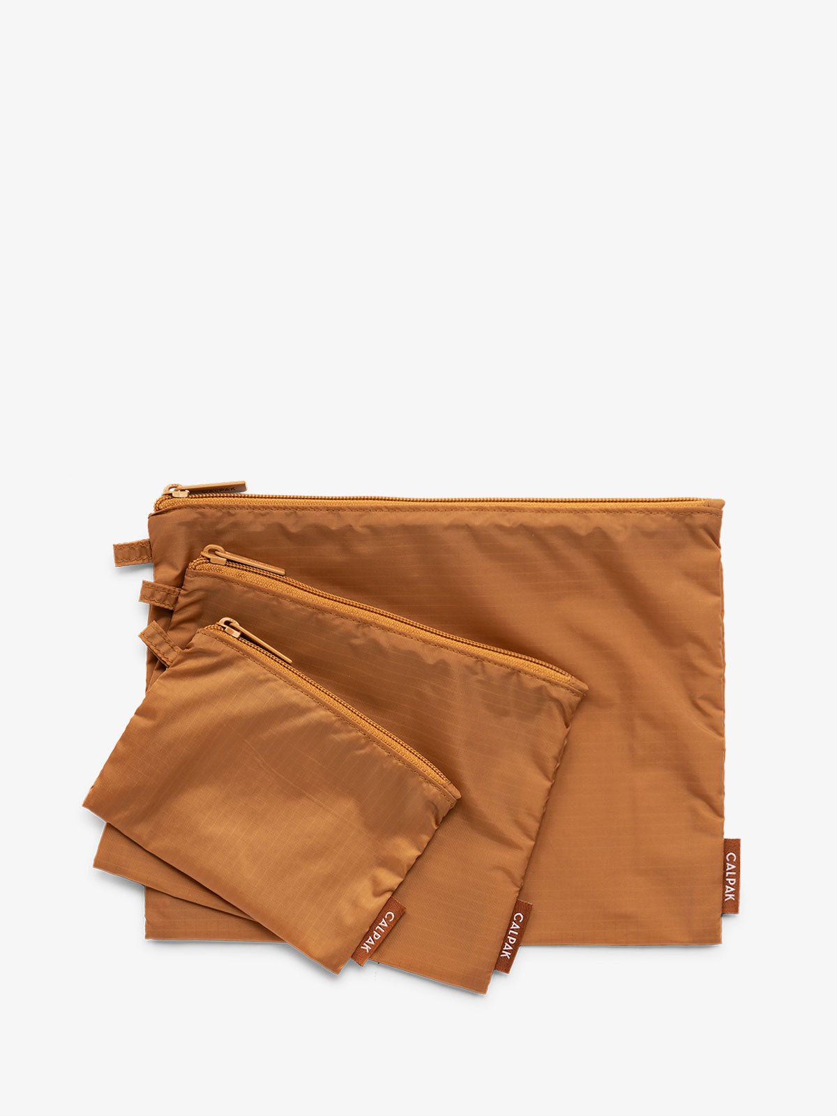 CALPAK Compakt zippered pouches in brown camel
