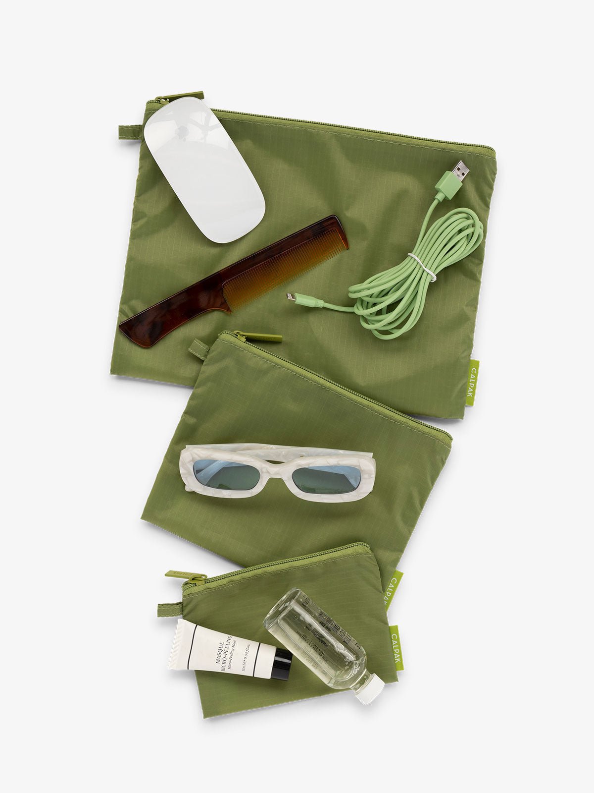 CALPAK Compakt 3 piece zippered pouch set in 3 sizes with water resistant material in palm green