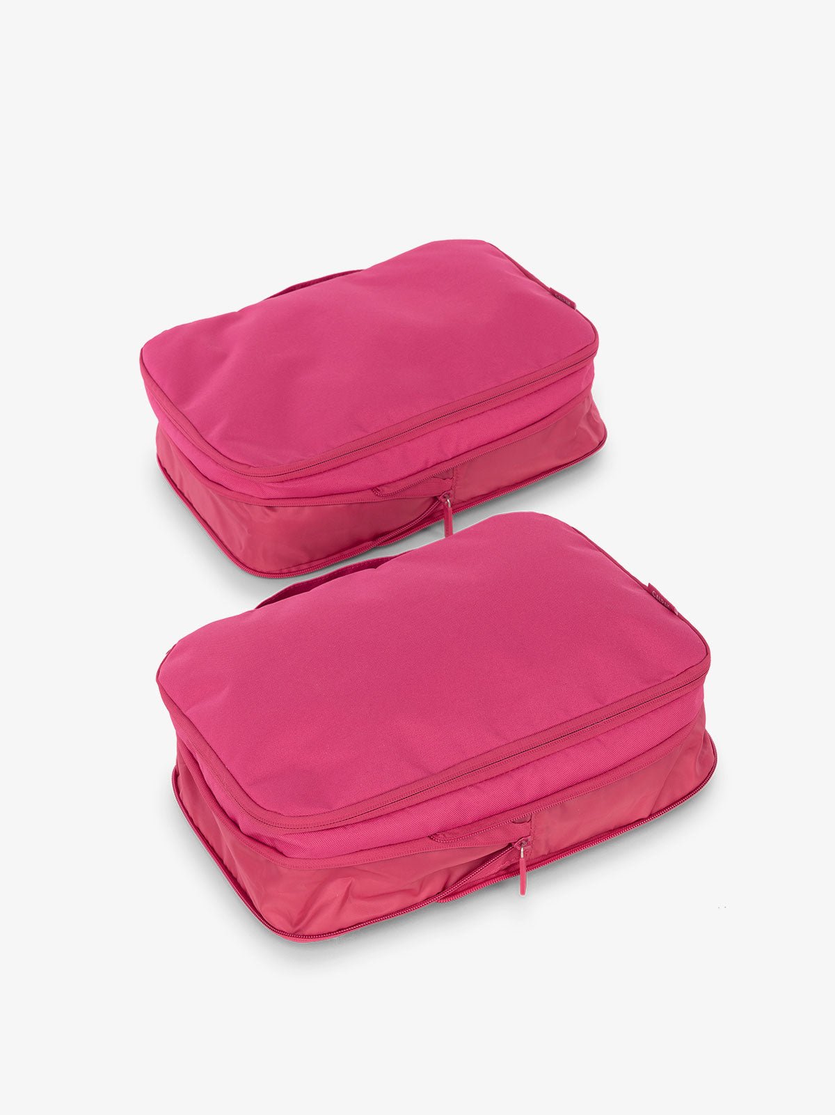 CALPAK compression packing cubes with top handles in pink