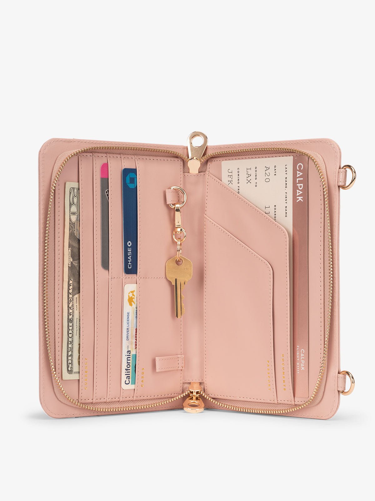 Interior of pink sand RFID lined CALPAK Croc Wallet featuring multiple pockets for cards and travel documents