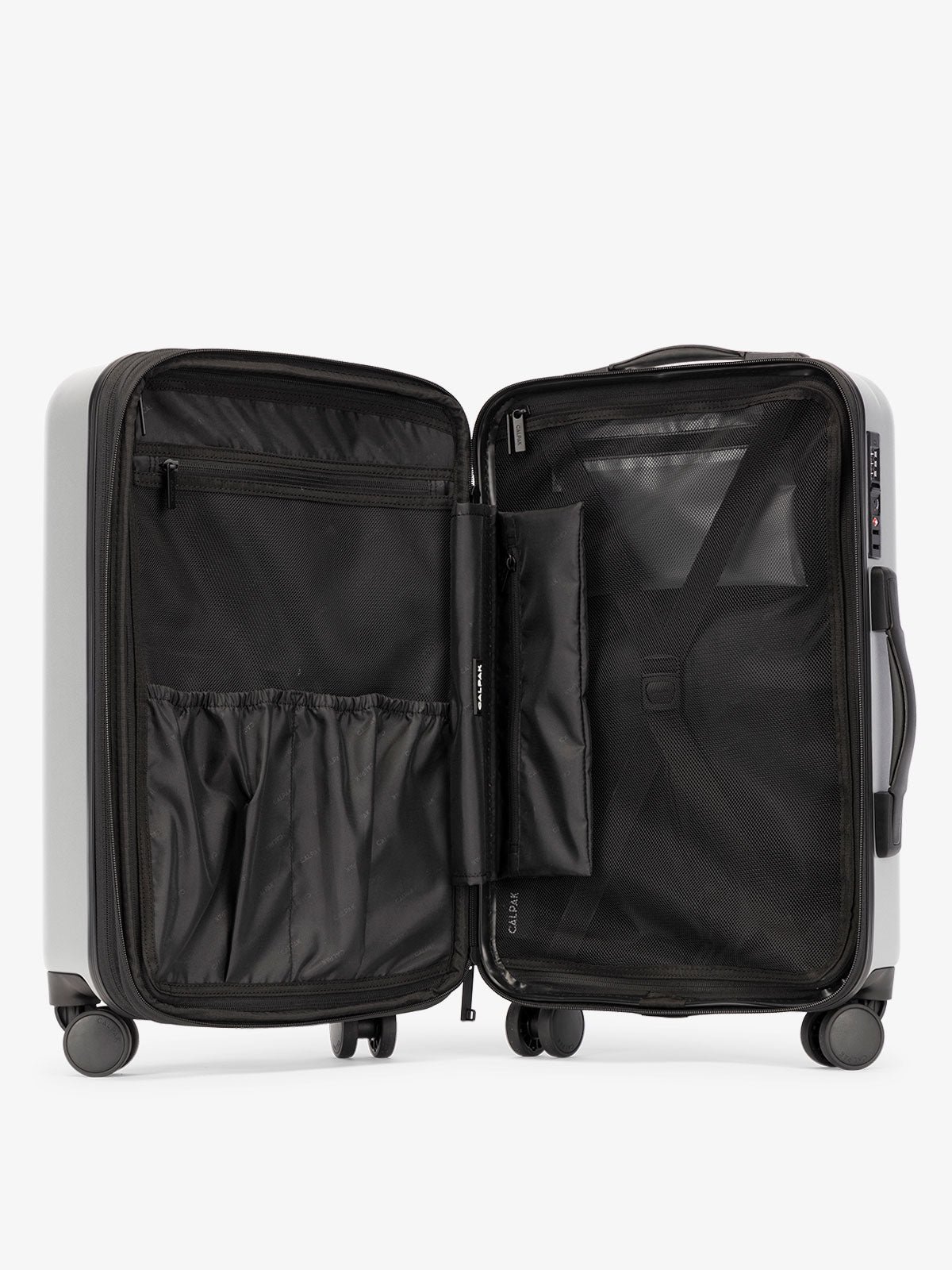 CALPAK Evry Carry-On Luggage features divided compartments with interior pockets for organized packing in smoke gray