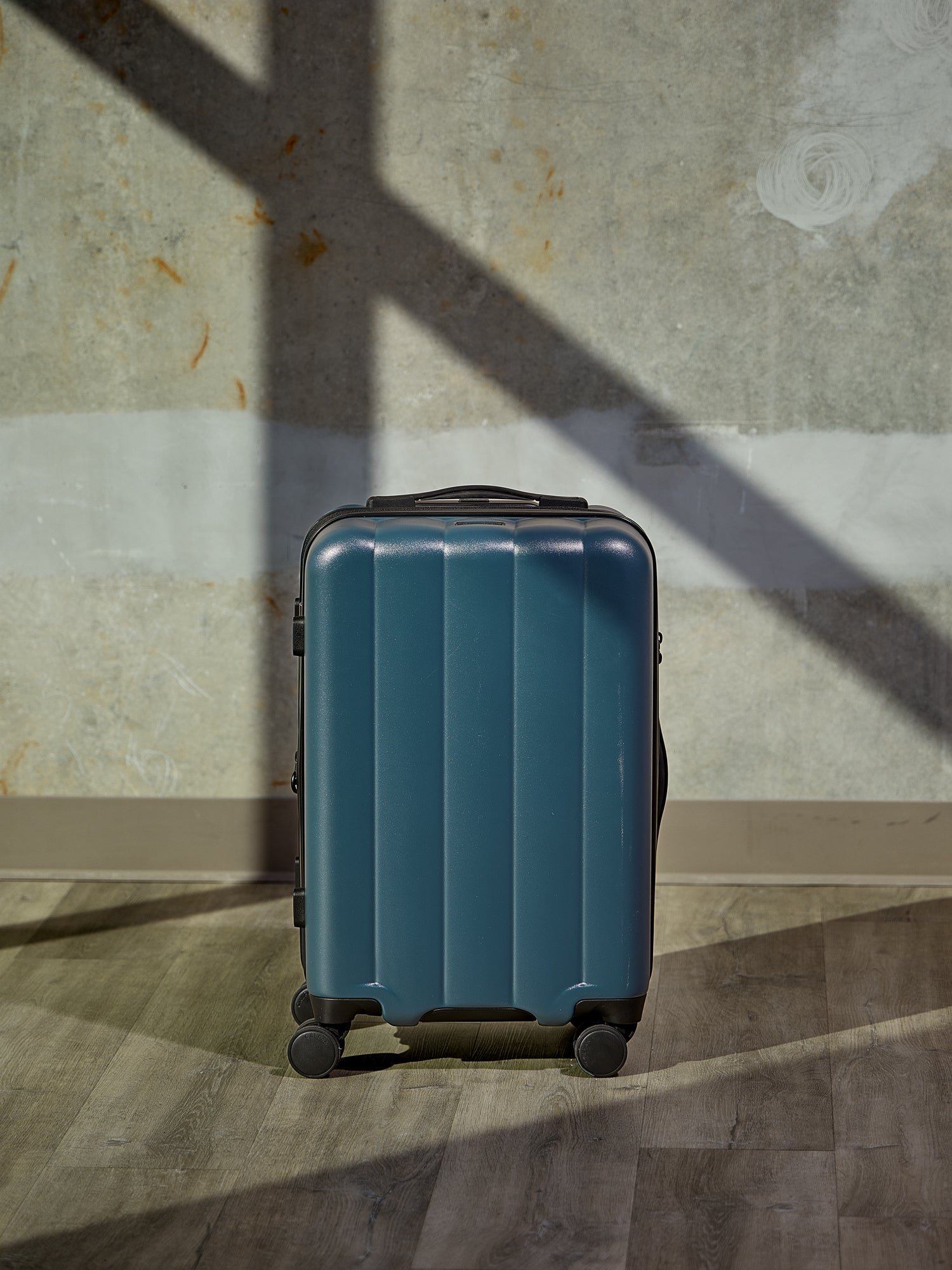 CALPAK Evry Carry-On Luggage in pacific blue featuring dual spinner wheels