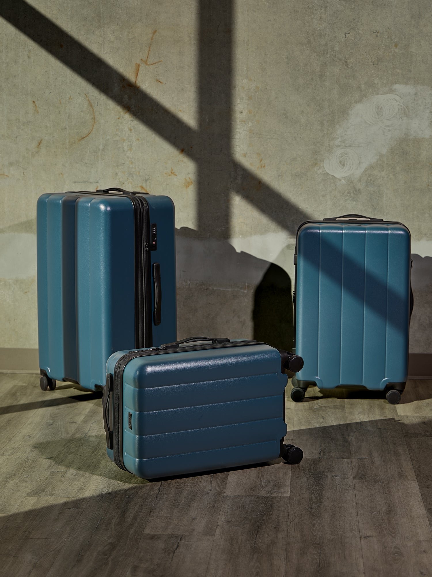 CALPAK Evry Carry-On Luggage, Evry Medium Luggage, and Evry Large Luggage in pacific blue
