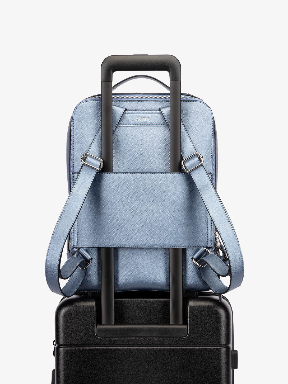 CALPAK Kaya Laptop Backpack for travel with trolley sleeve and adjustable straps in metallic light blue stargaze