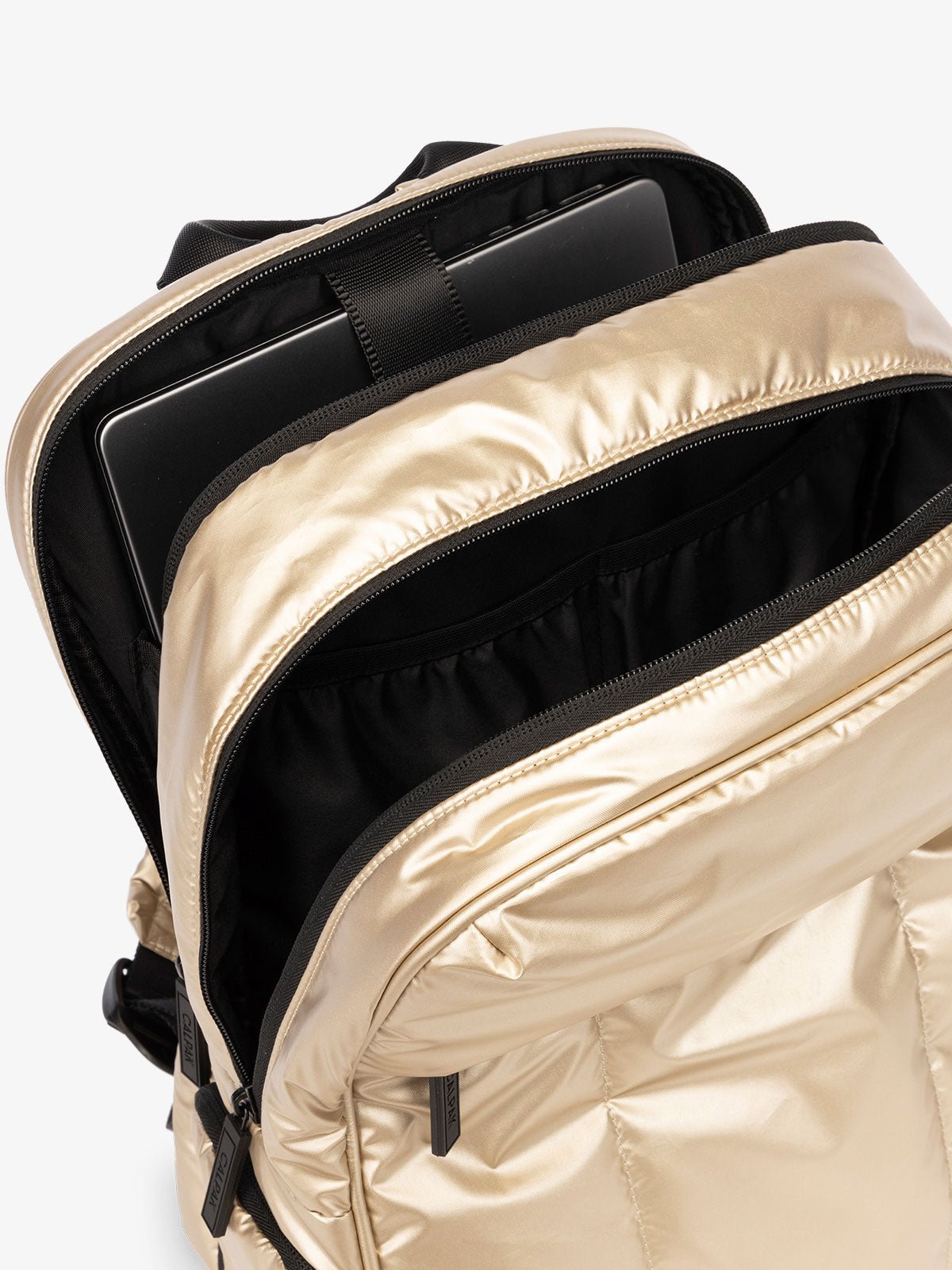 CALPAK Luka 15 Inch Laptop Backpack with soft puffy exterior and multiple pockets in gold