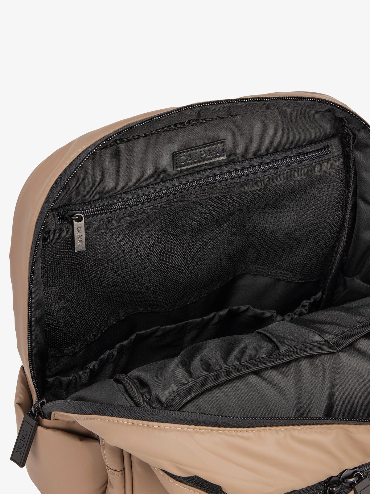 Close up of main compartment of CALPAK laptop backpack with multiple interior pockets in chocolate