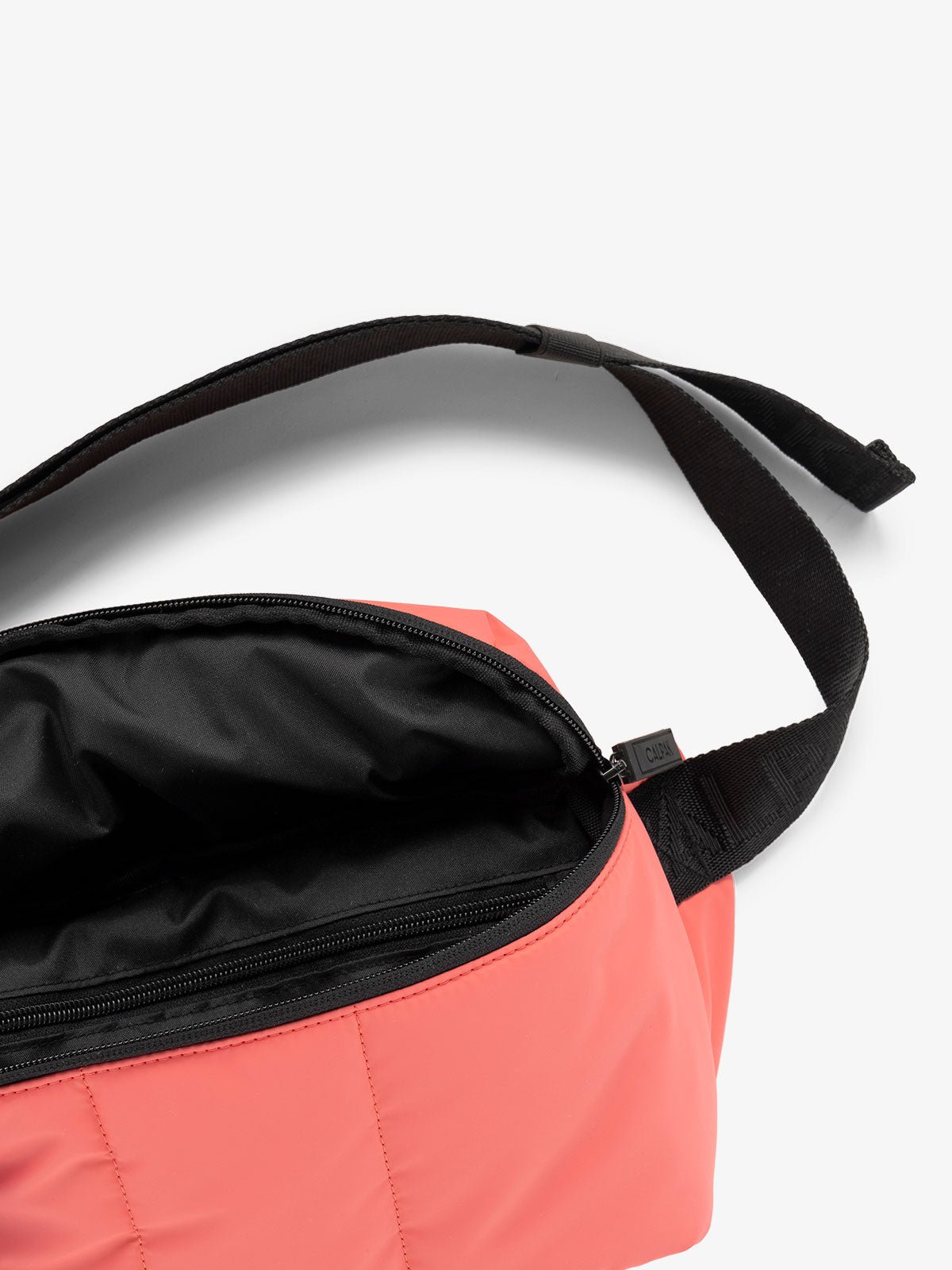 CALPAK Luka Belt Bag close up interior and strap in pink