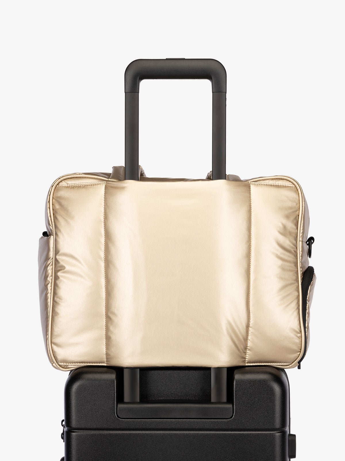 CALPAK Luka Duffel bag with luggage trolley sleeve in metallic gold