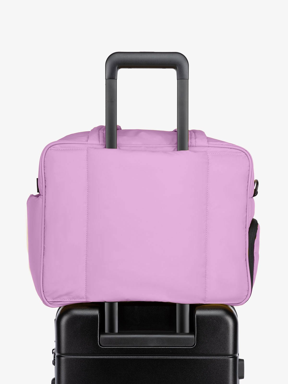 CALPAK Luka Duffel bag with luggage trolley sleeve in light purple lilac