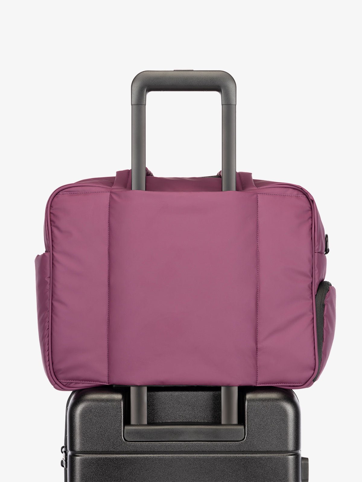 CALPAK Luka Duffel bag with luggage trolley sleeve in purple