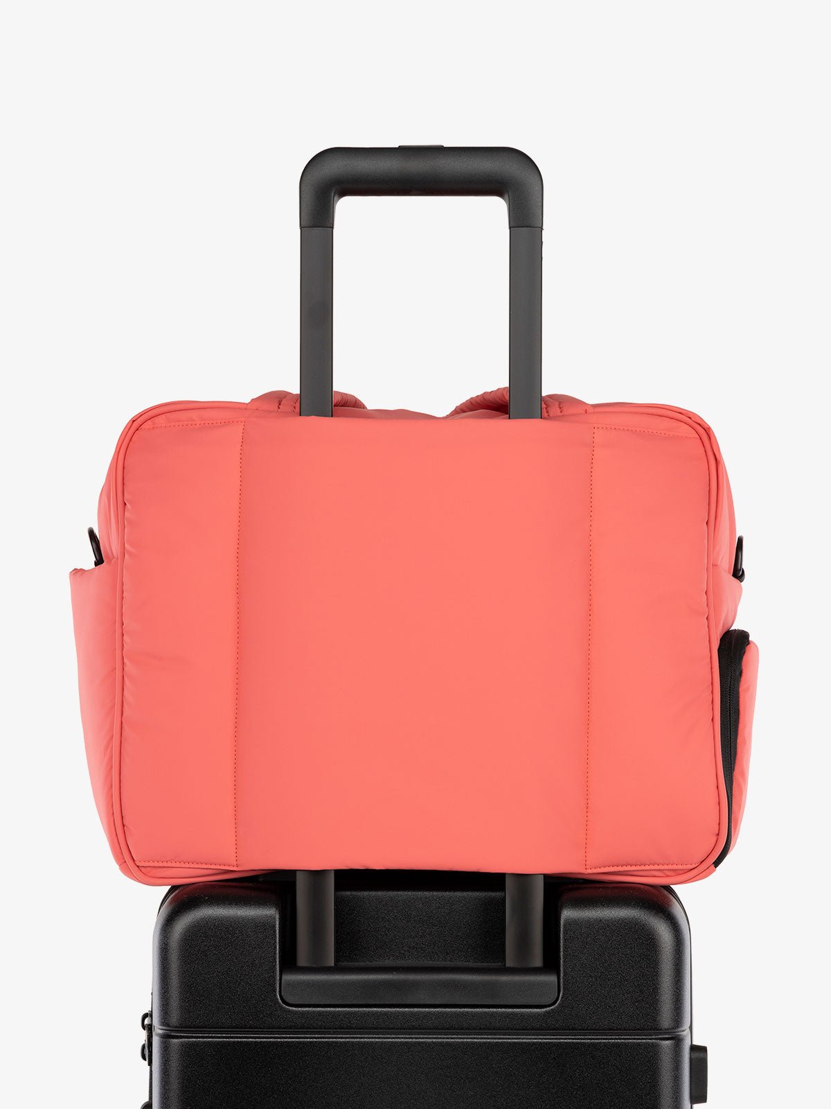 CALPAK Luka Weekender Duffel Bag with trolley sleeve for travel in pink