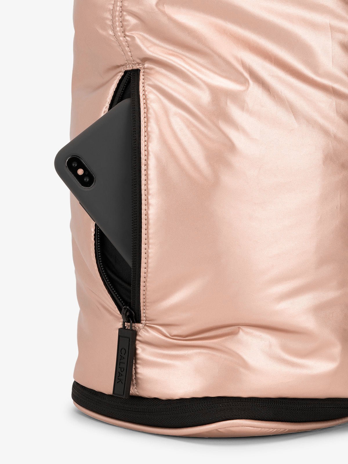 CALPAK Luka expandable laptop bag with hidden zippered pockets in metallic pink