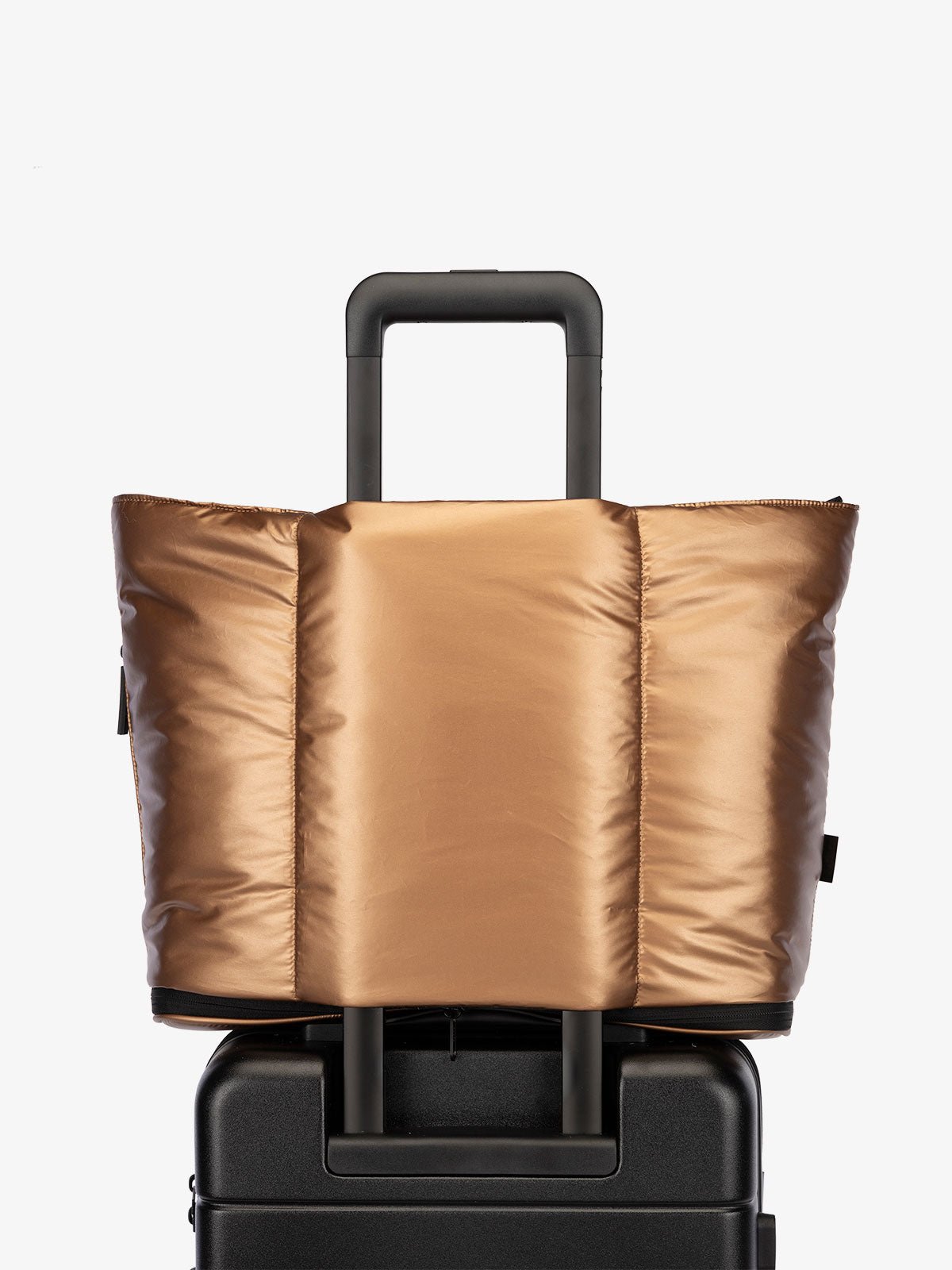 CALPAK Luka expandable travel bag with laptop compartment and trolley sleeve in metallic copper