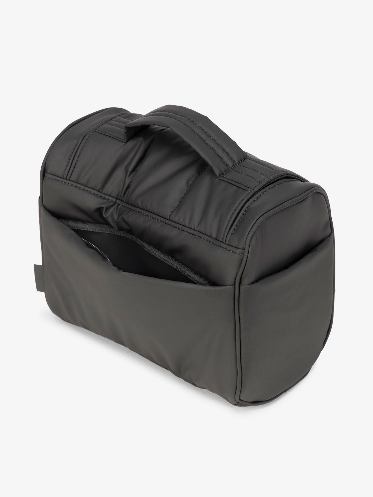 Matte black CALPAK Luka Hanging Toiletry Bag featuring additional secure zippered back pocket