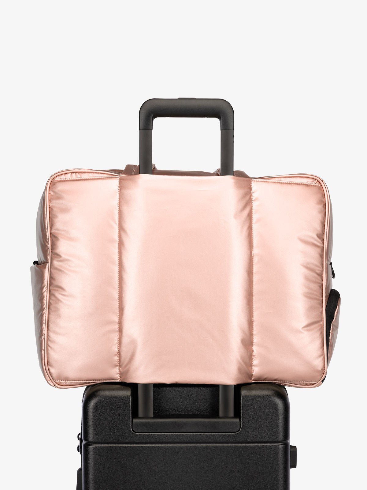 CALPAK Luka large travel duffel bag with trolley sleeve for luggage in rose gold