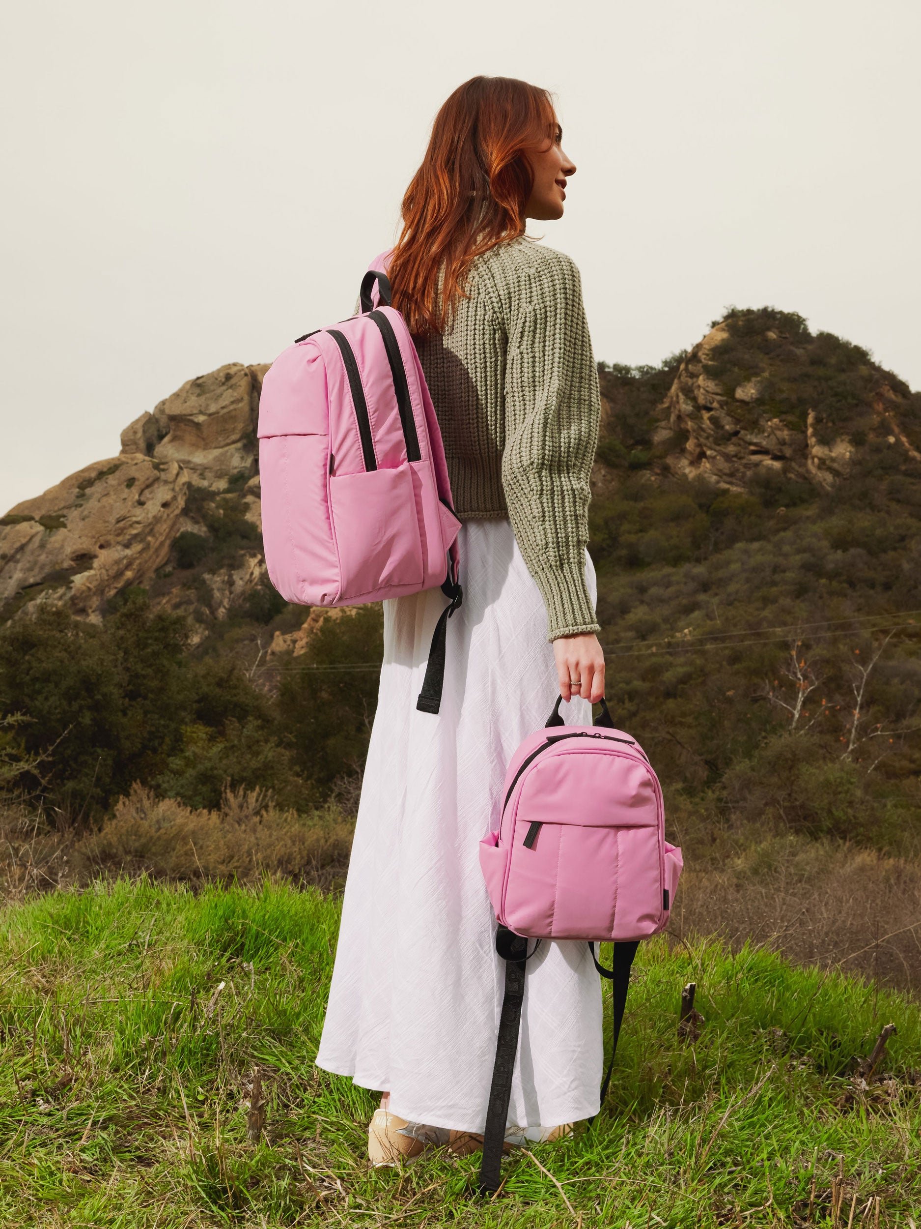 CALPAK Luka small everyday Backpack with adjustable straps and side pockets in bubblegum pink