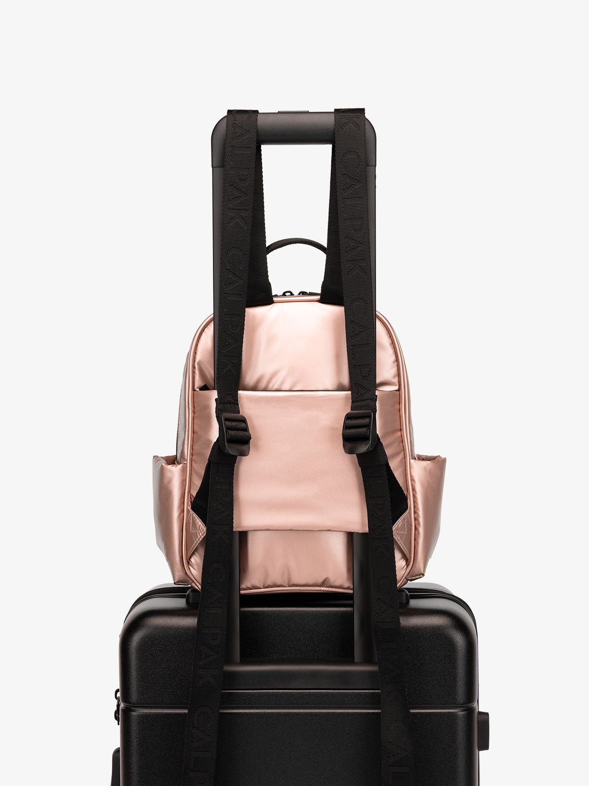 CALPAK Luka small travel Backpack with luggage sleeve and adjustable straps in rose gold