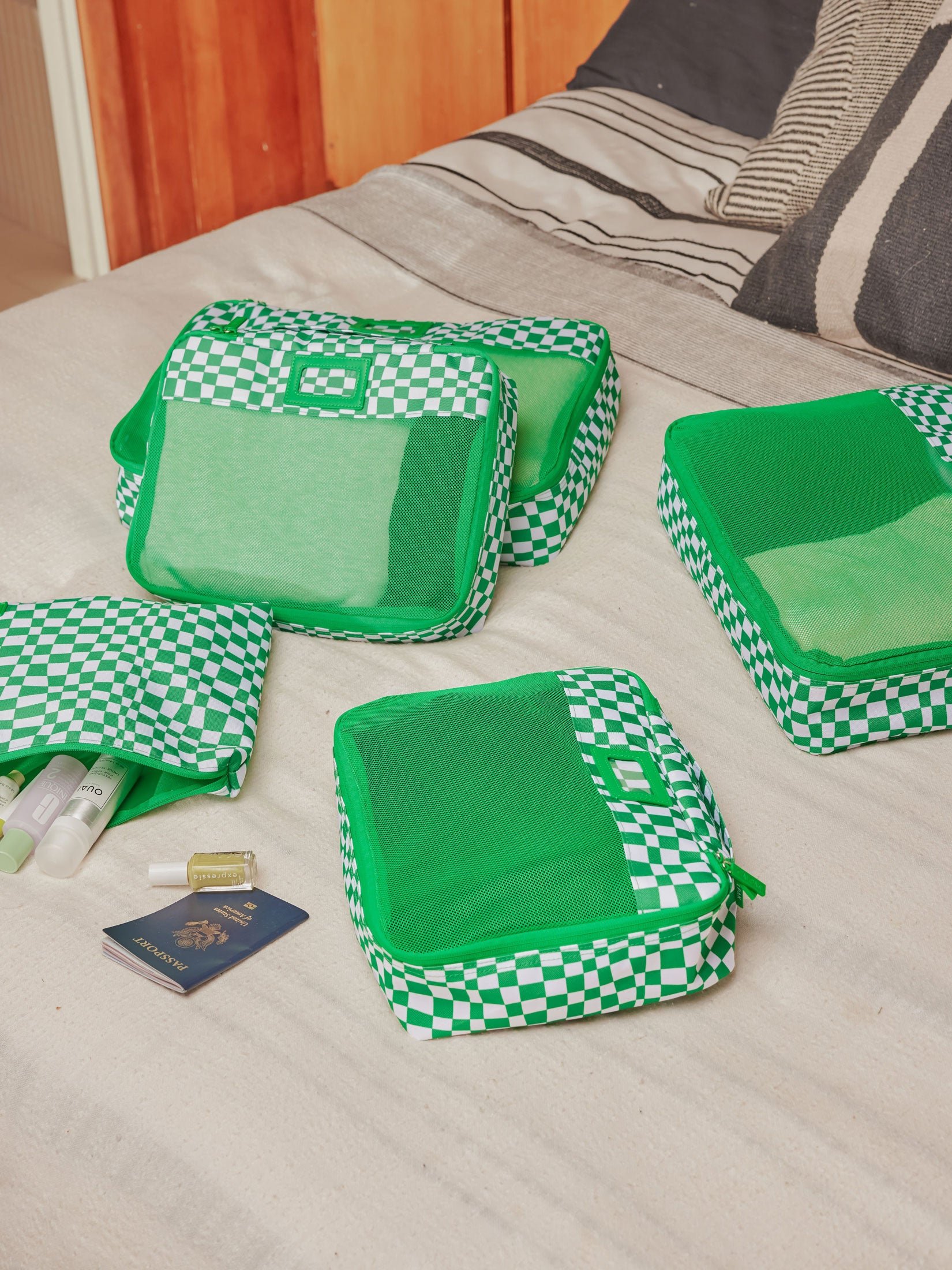 CALPAK 5 piece set packing cubes for travel with labels and top handles mesh front in green checkerboard pattern