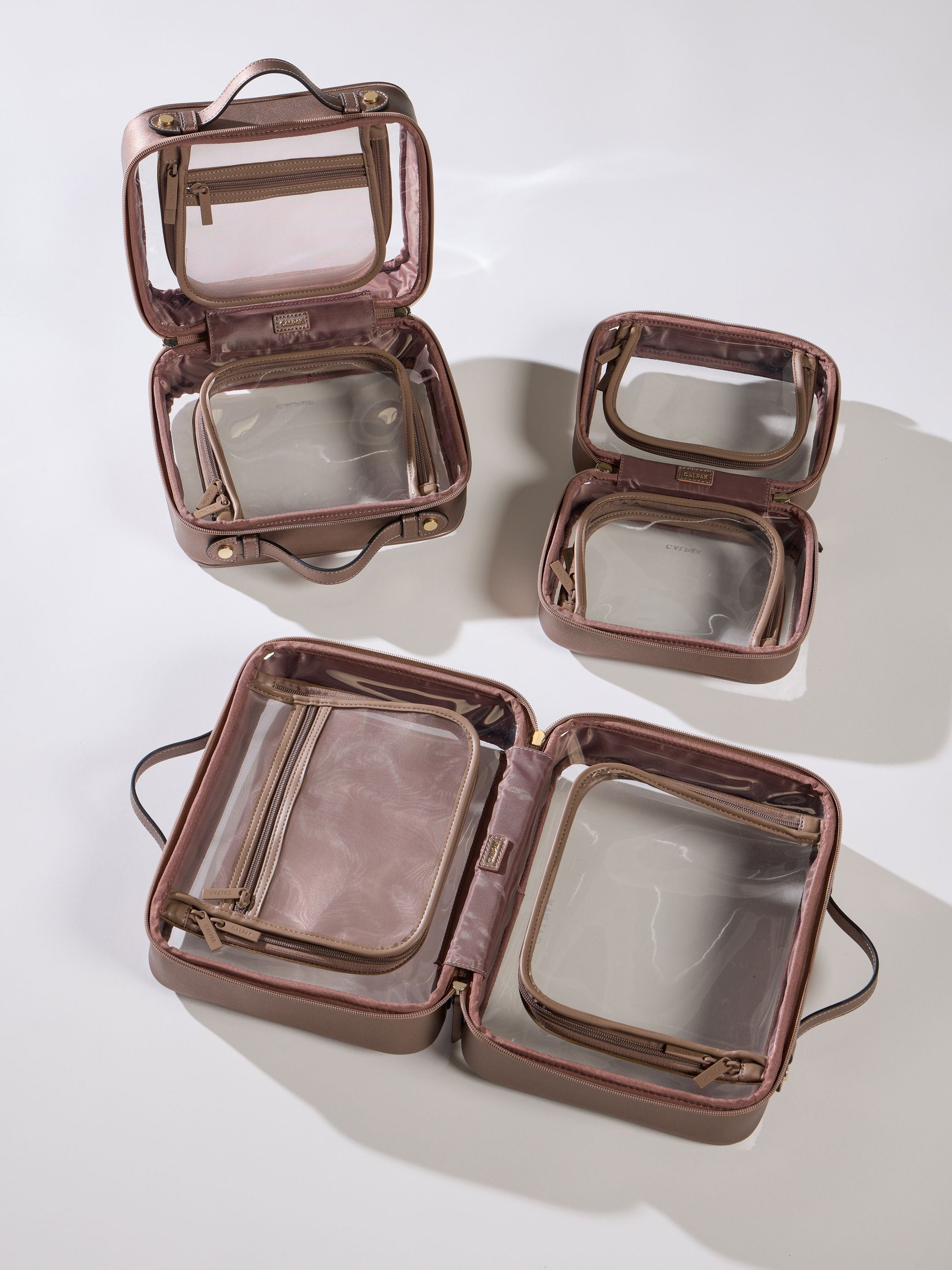 CALPAK Clear Cosmetic Cases in all size offerings in metallic bronze