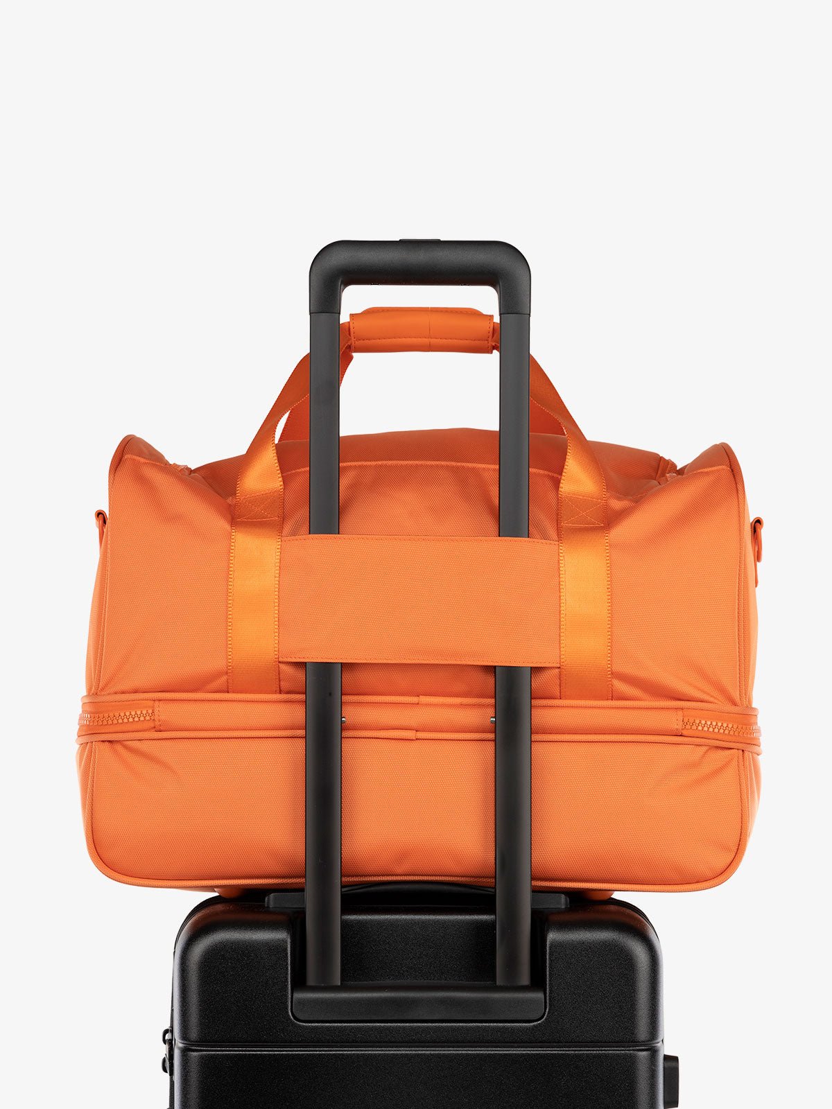 CALPAK Stevyn Duffel bag with trolley sleeve in orange