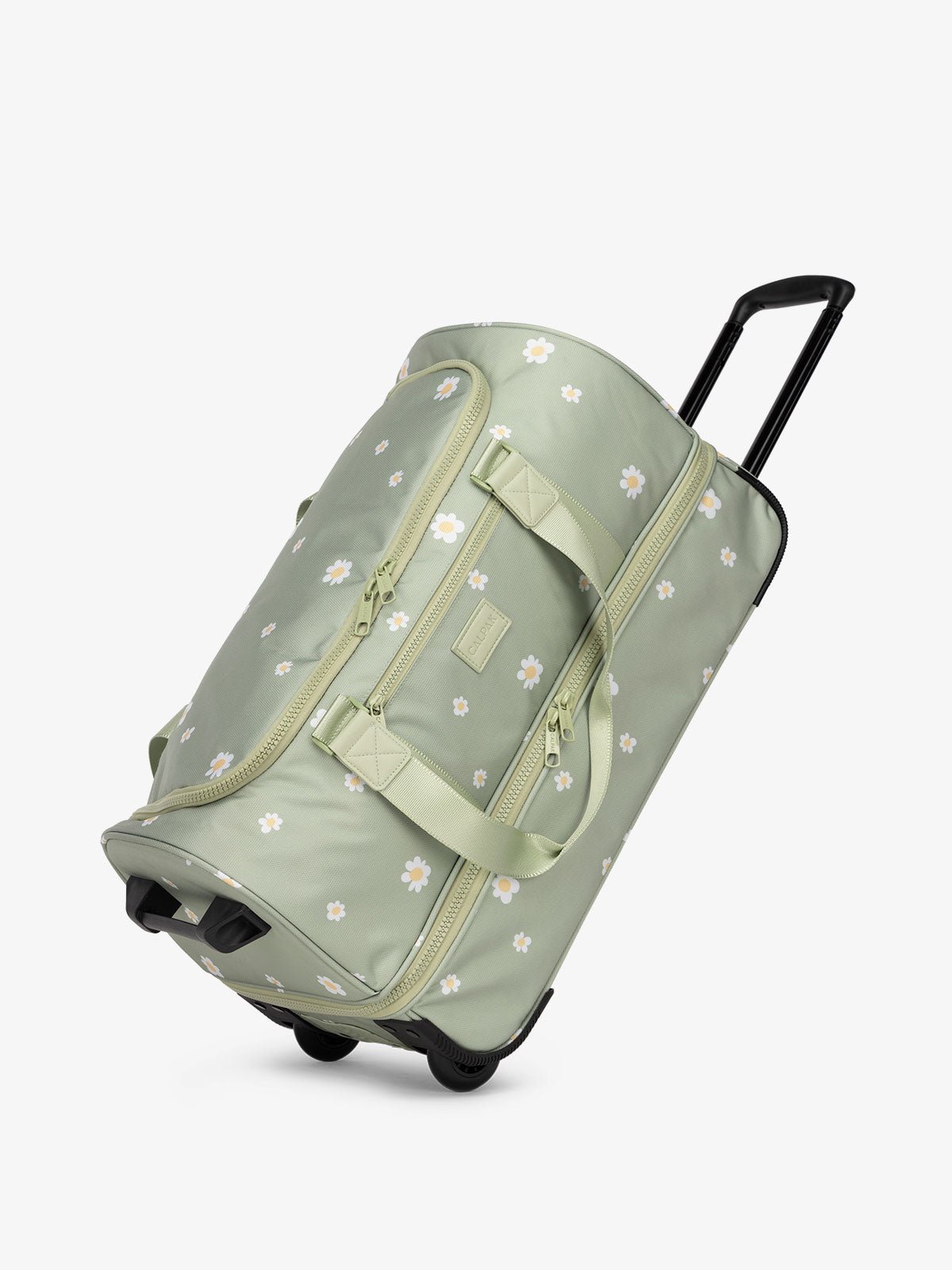 CALPAK Stevyn Rolling Duffel side view with top handle extended in daisy floral print