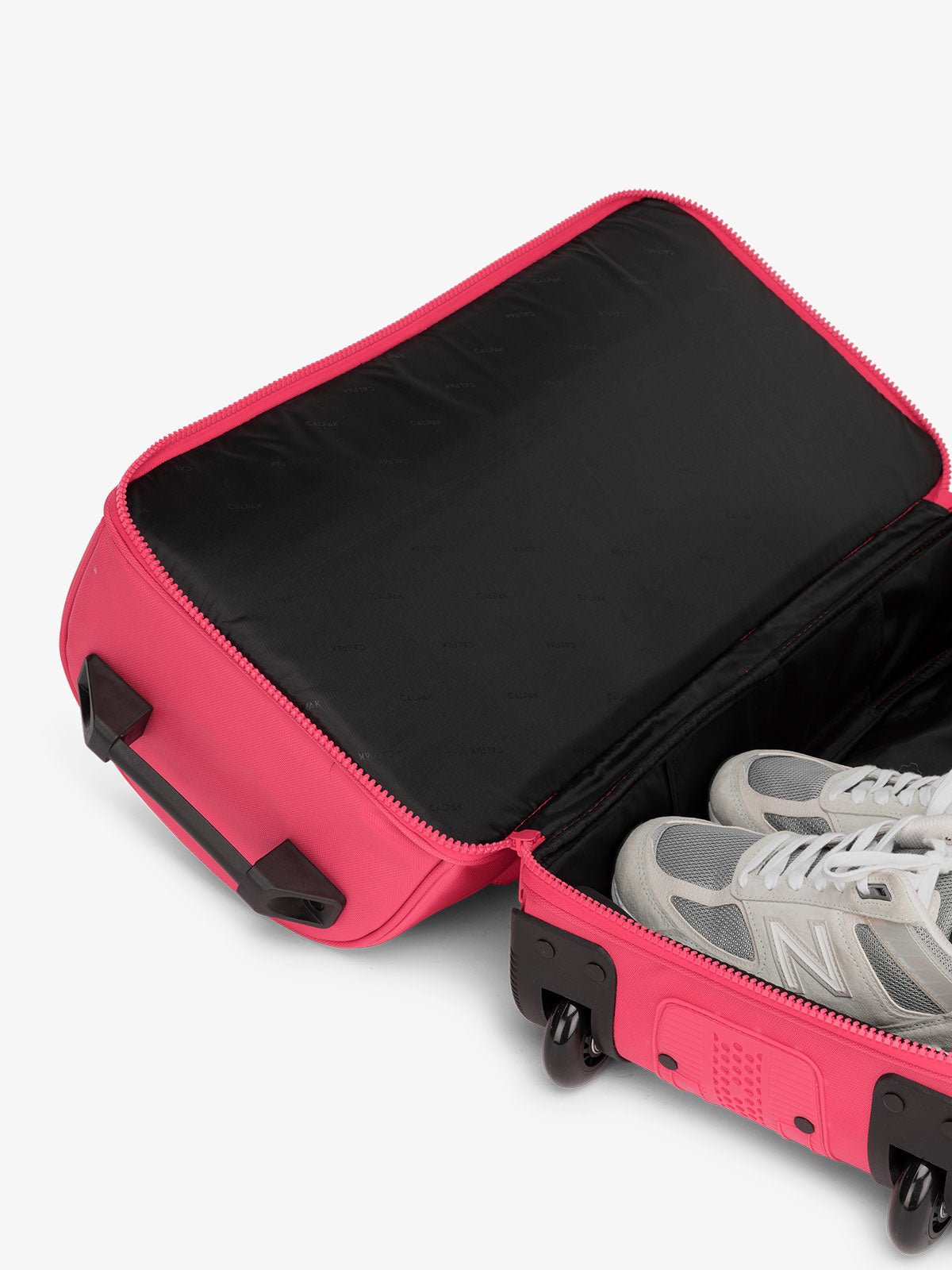 CALPAK Stevyn Rolling Duffle interior of shoe compartment in dragonfruit pink