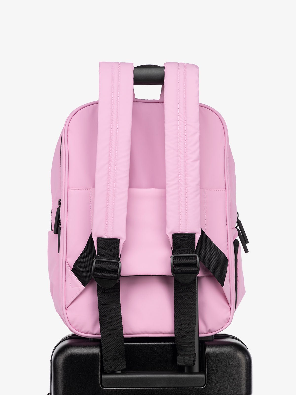 CALPAK Luka Laptop Backpack with adjustable shoulder straps and luggage sleeve in bubblegum pink