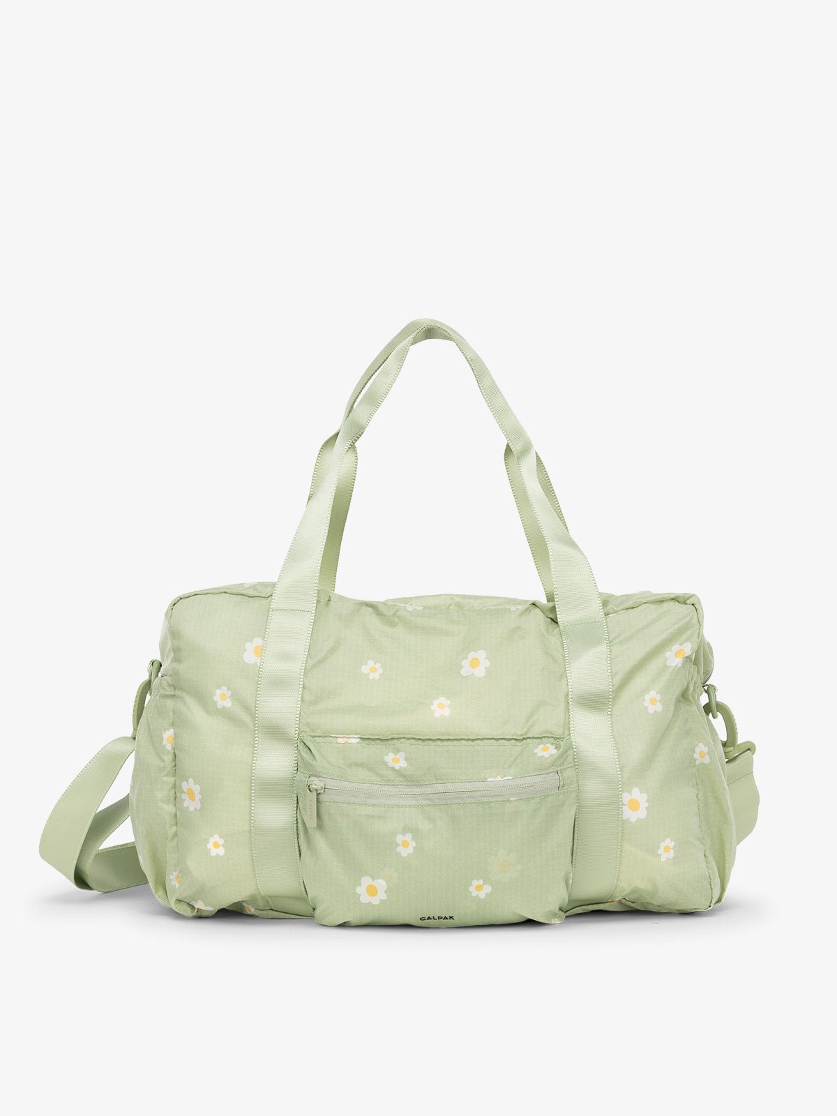 CALPAK Compakt duffel bag with removable crossbody strap and water resistant fabric in light green floral print