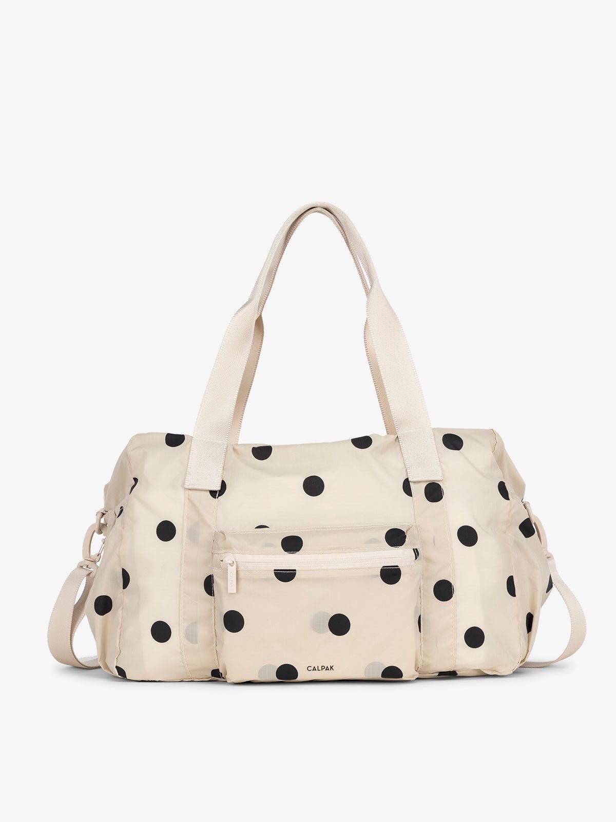 CALPAK lightweight duffle bag in polka dot for everyday