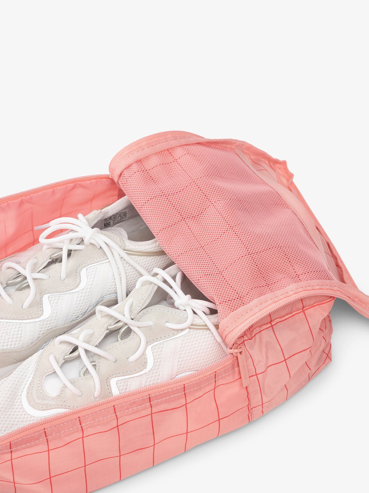CALPAK Compakt zippered shoe travel bag with mesh pocket in pink grid print