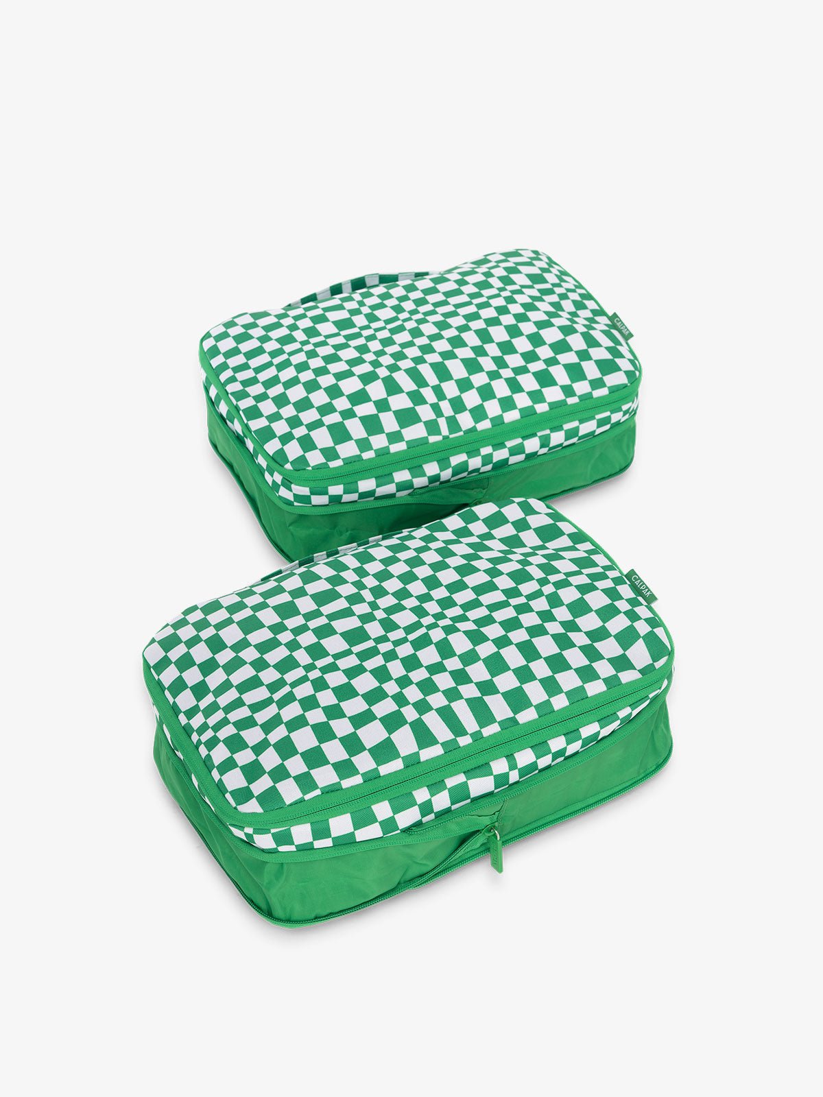CALPAK compression packing cubes with handles in green checkerboard print
