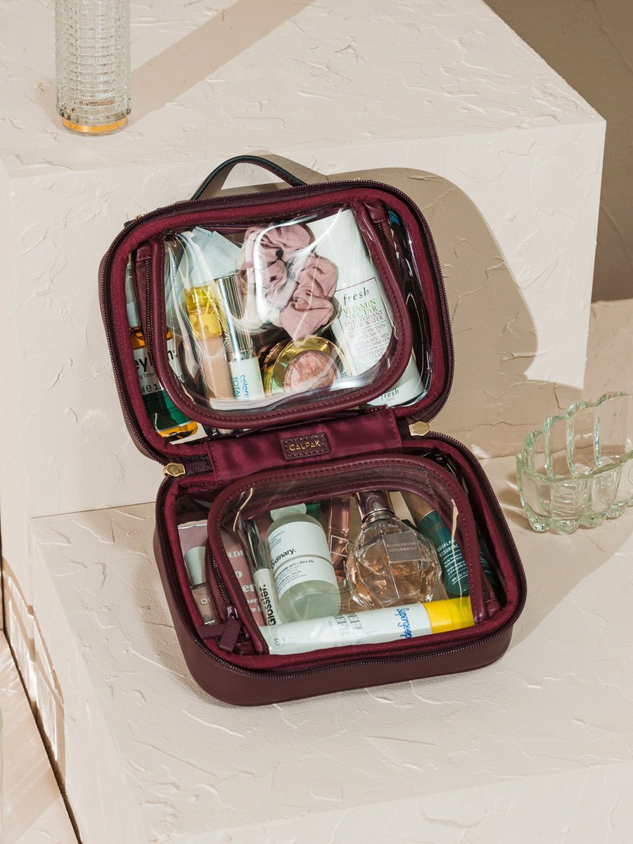 CALPAK mini cosmetics case for travel in burgundy