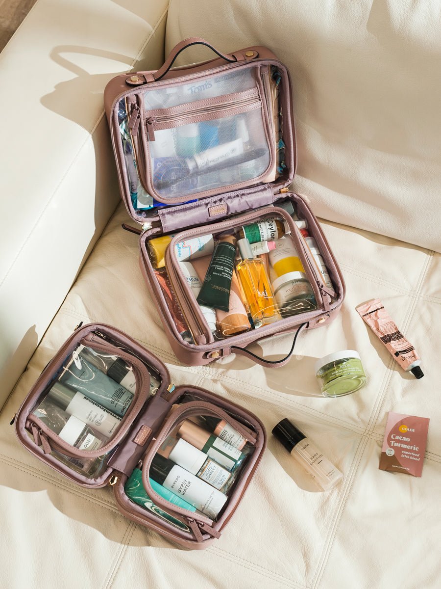 CALPAK small transparent cosmetics case with zippered compartments in pink