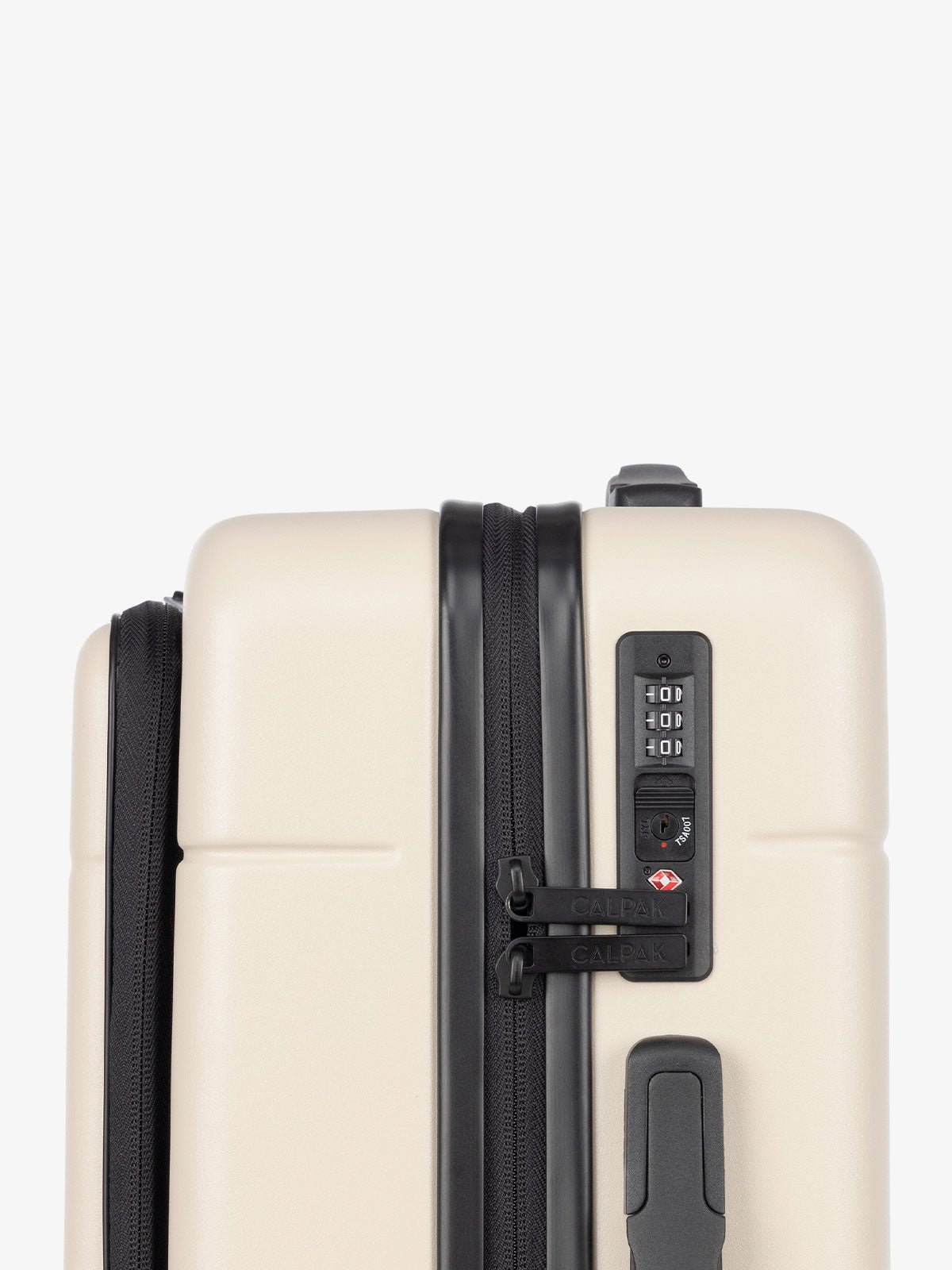 TSA lock of CALPAK Hue hardside carry-on suitcase with front pocket laptop compartment in cream linen color
