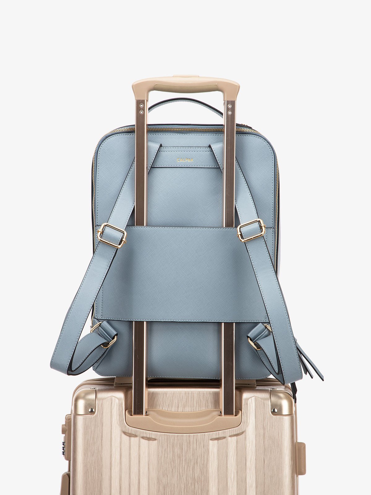 CALPAK Kaya laptop backpack with luggage trolley sleeve in blue bell color