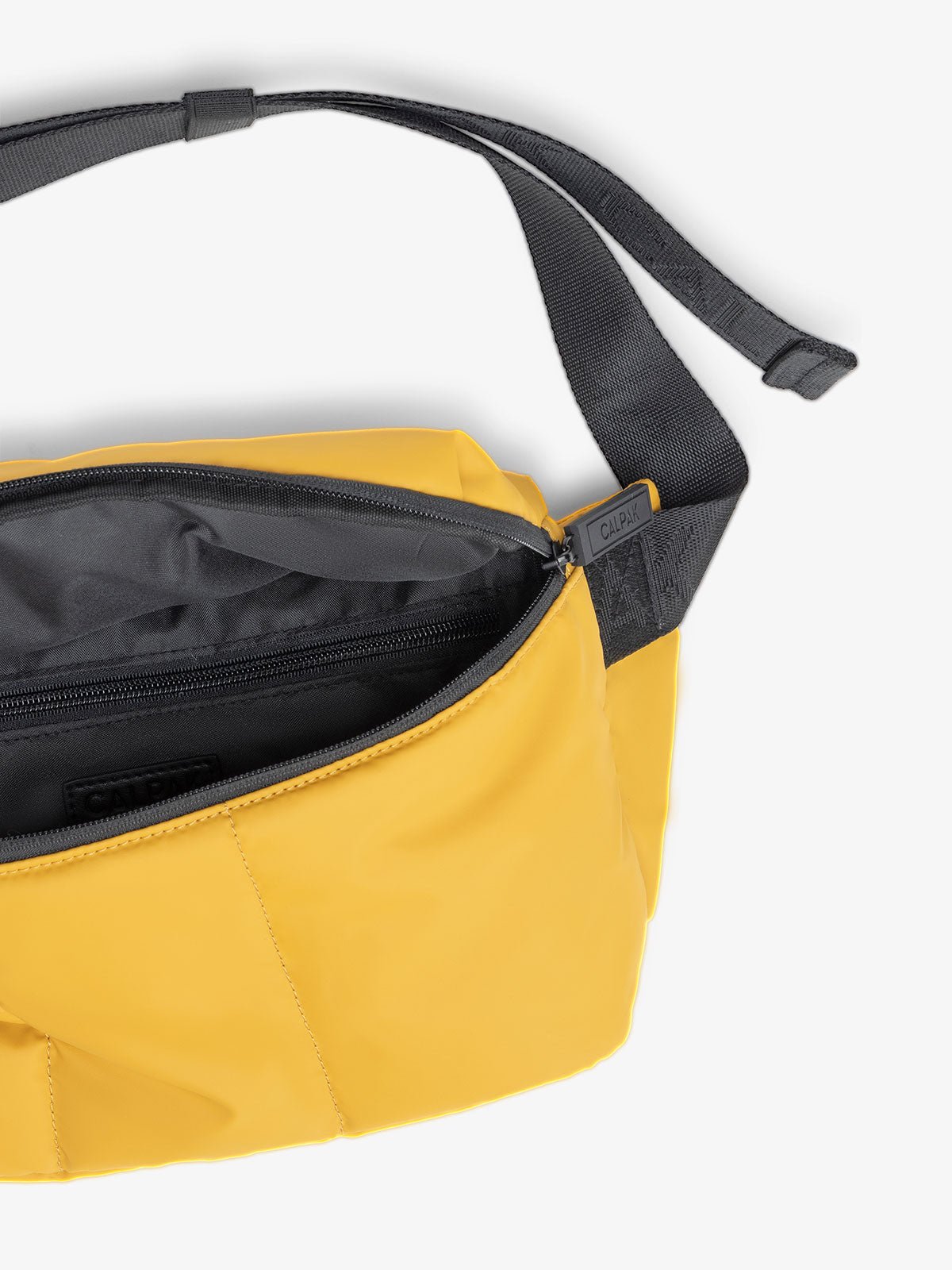 CALPAK Luka belt bag in yellow dijon color