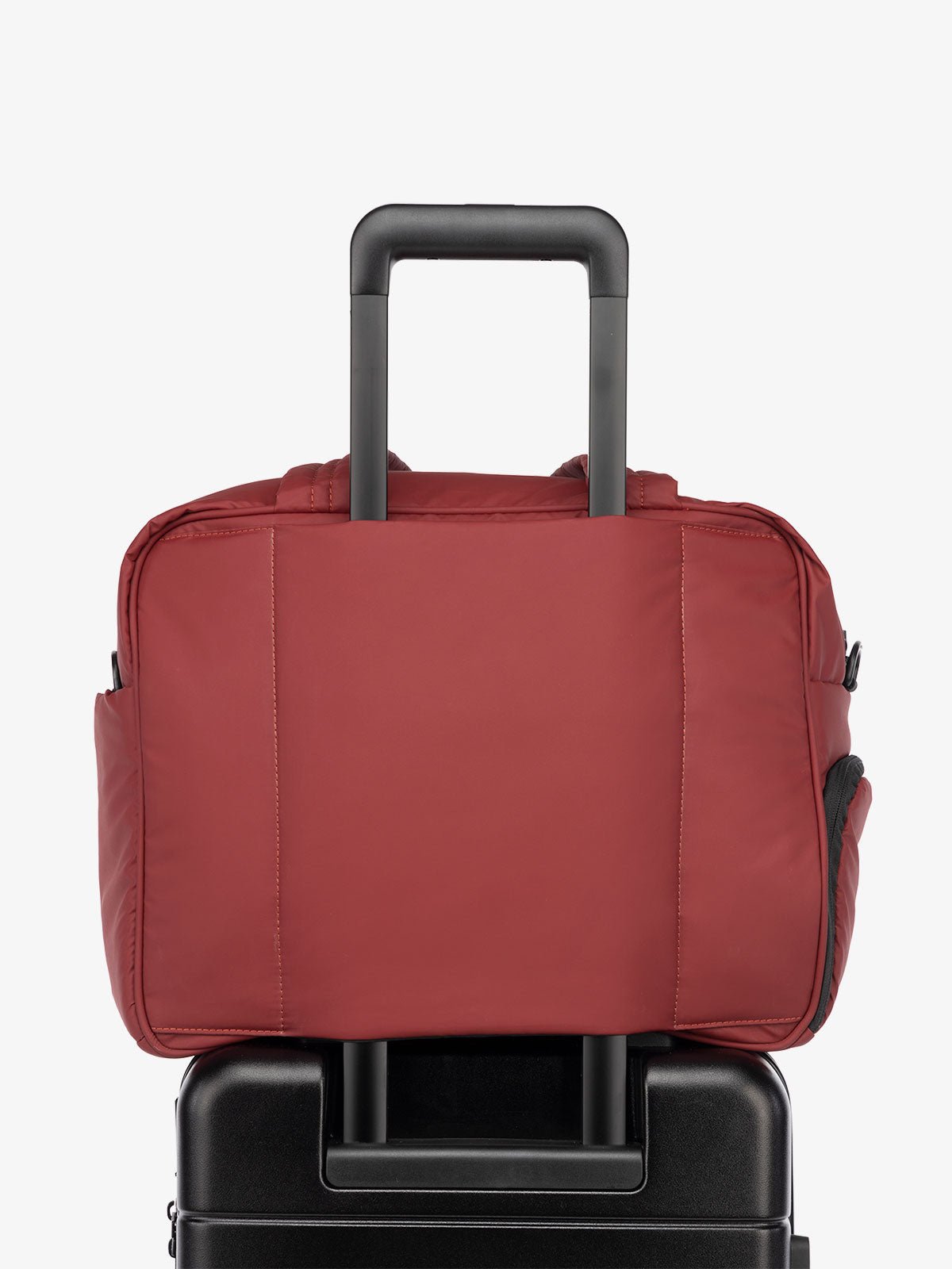 CALPAK Luka Duffle Bag with luggage sleeve in merlot