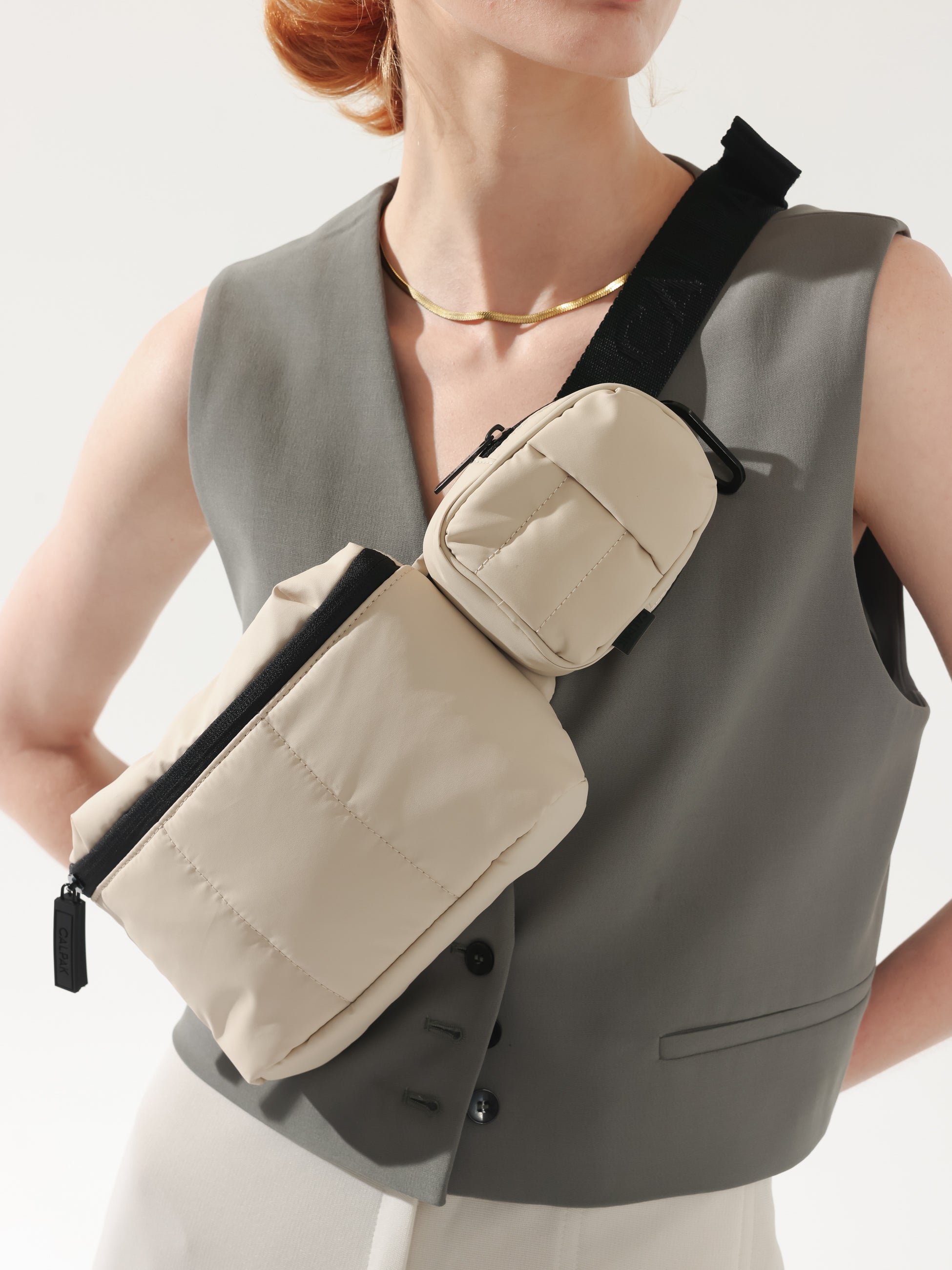 CALPAK Luka backpack key chain with back versatile elastic wrist strap in cream