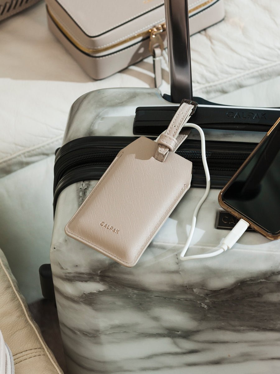 CALPAK portable charger luggage tag in stone