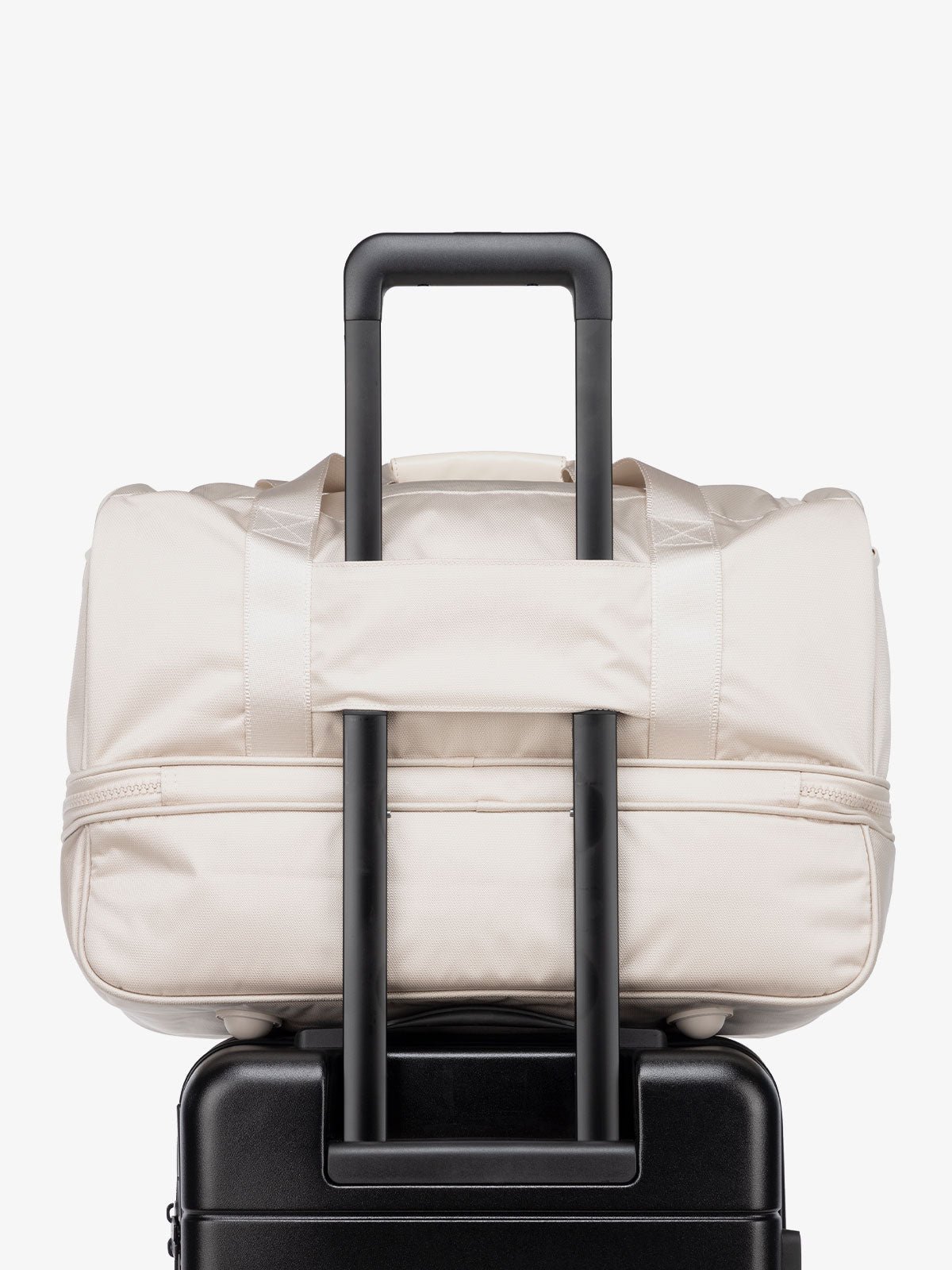 cream dune Stevyn duffel bag with luggage trolley sleeve