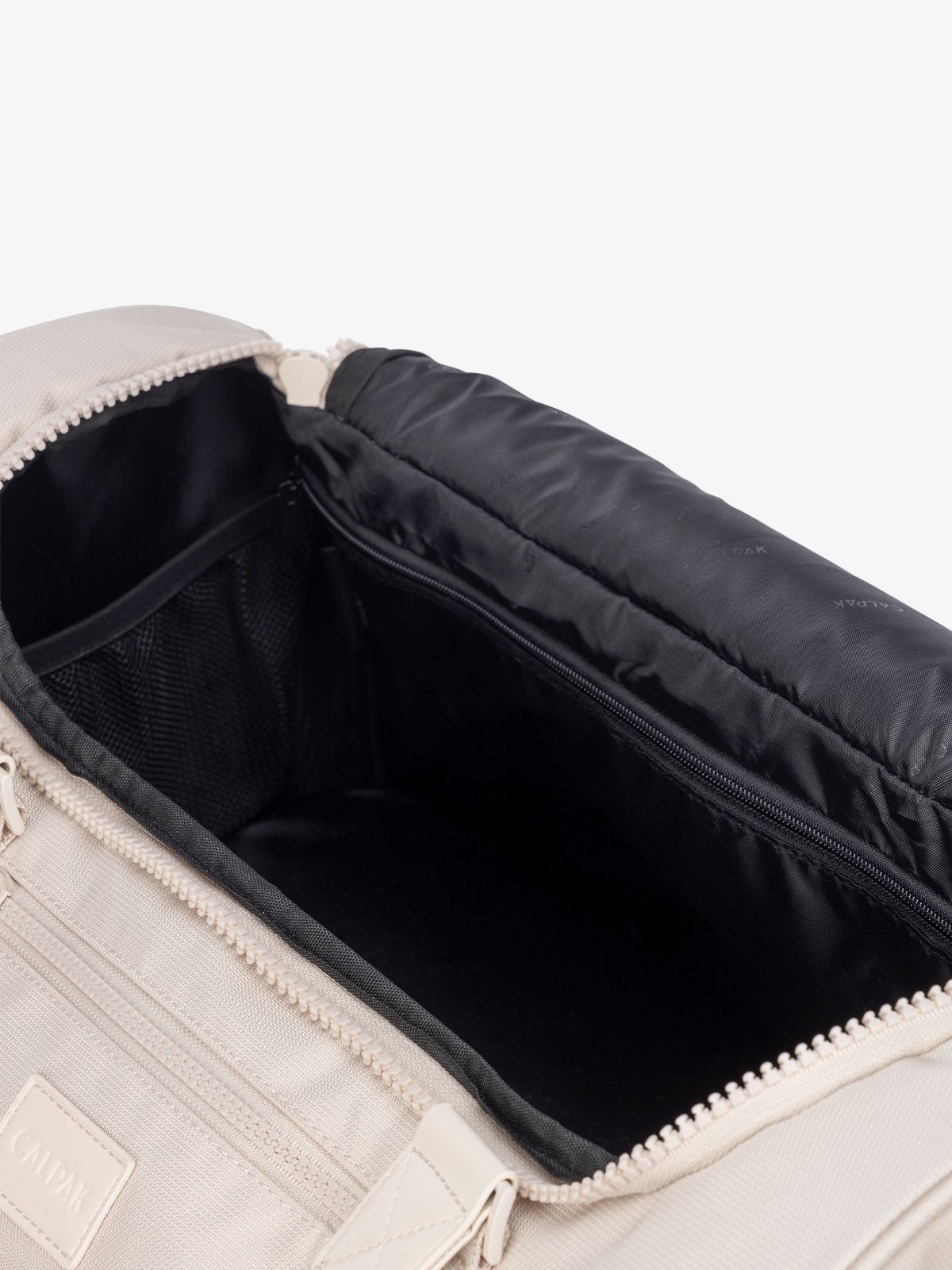 interior of cream dune CALPAK Stevyn duffel bag
