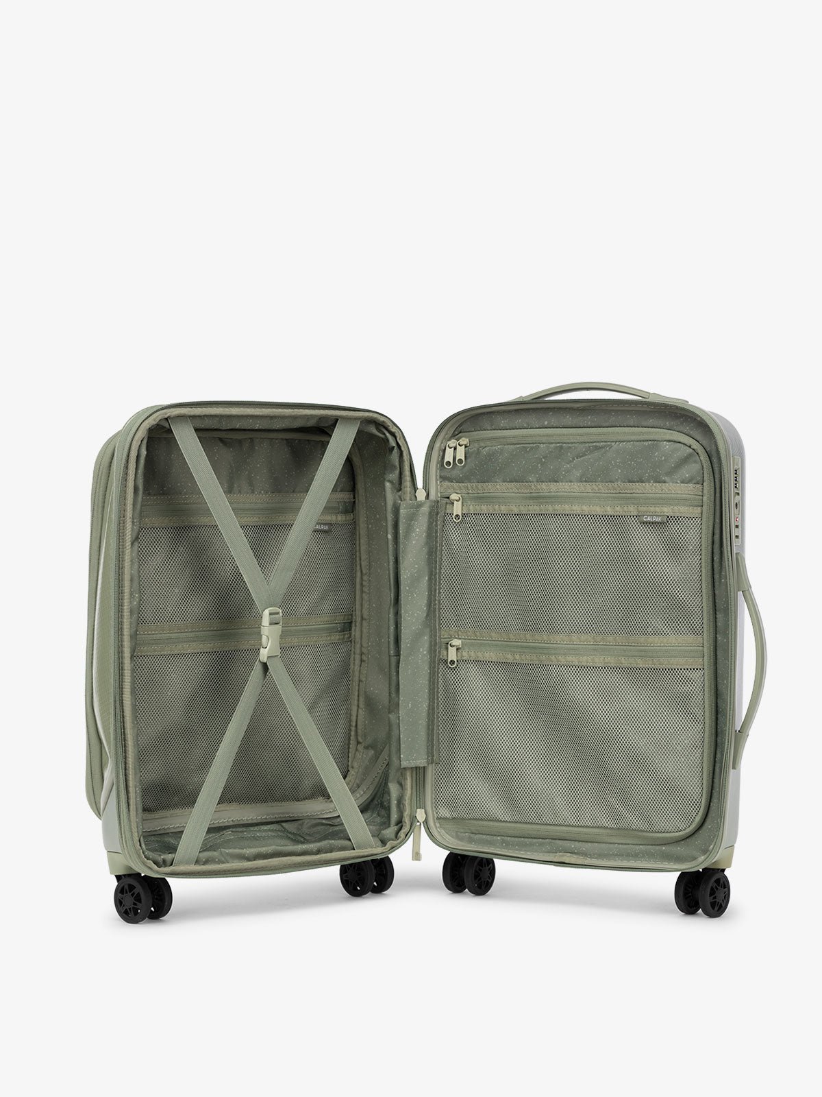 CALPAK Terra Carry-On Luggage interior with multiple pockets and 360 spinner wheels and compression strap in juniper