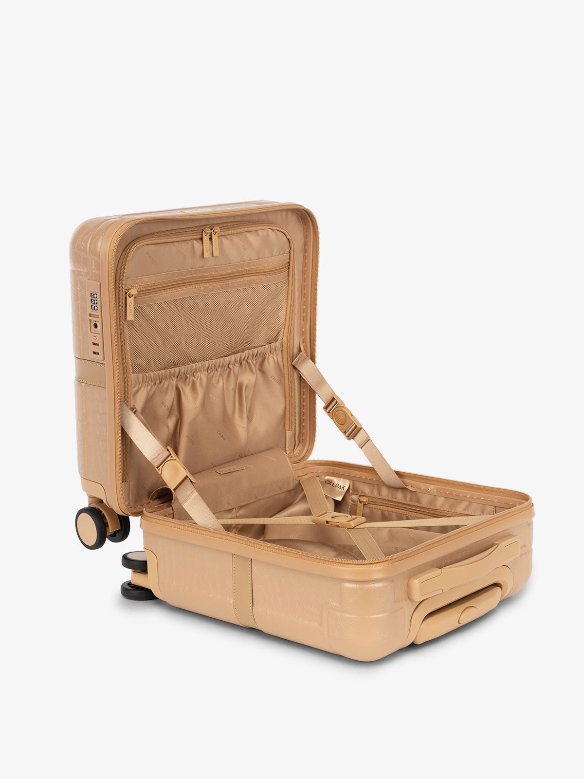 CALPAK TRNK small carry on luggage with wheels, interior compression strap and multiple pockets in almond