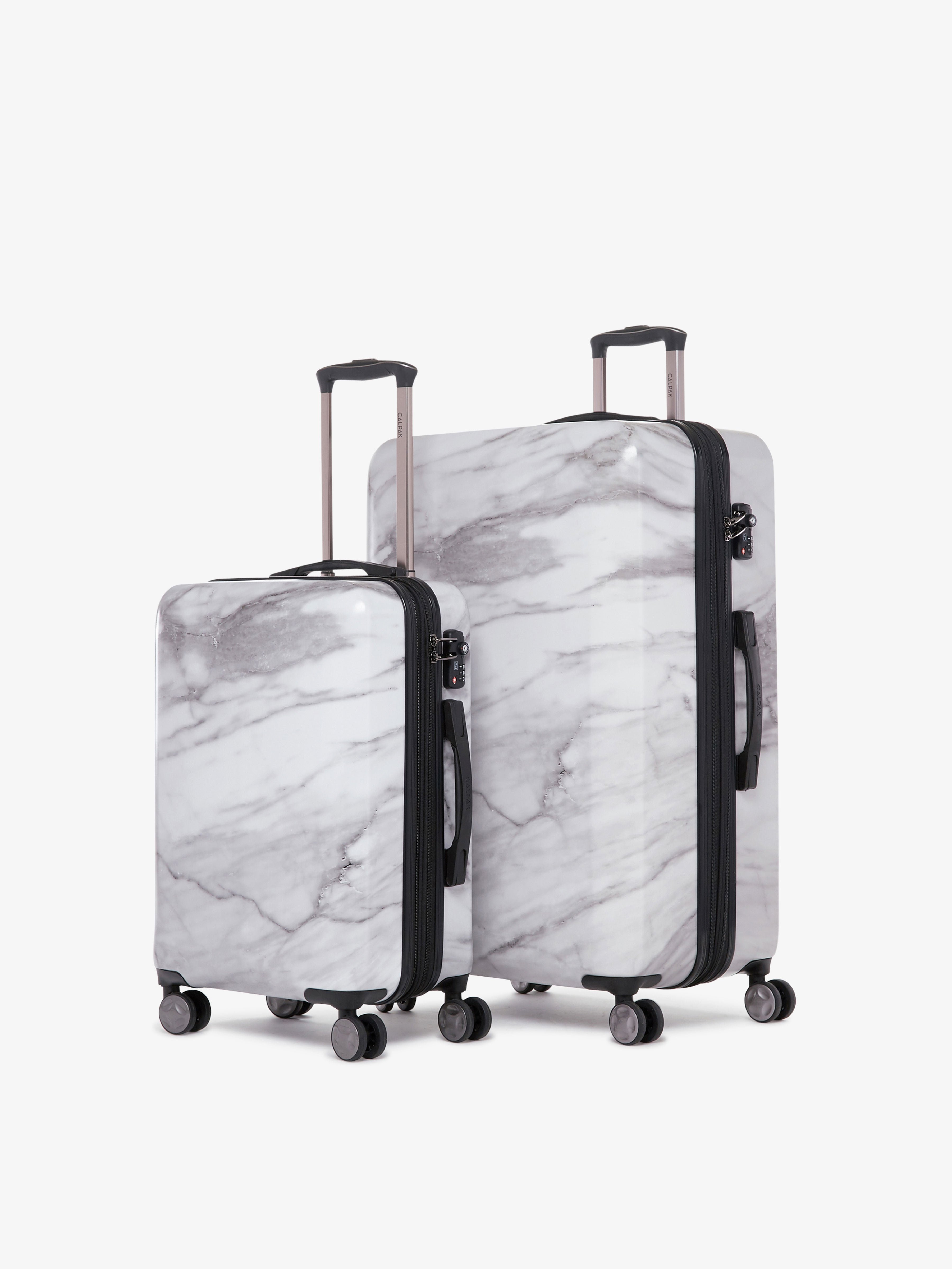 2 piece CALPAK Astyll white marble luggage set that includes carry on and large suitcase
