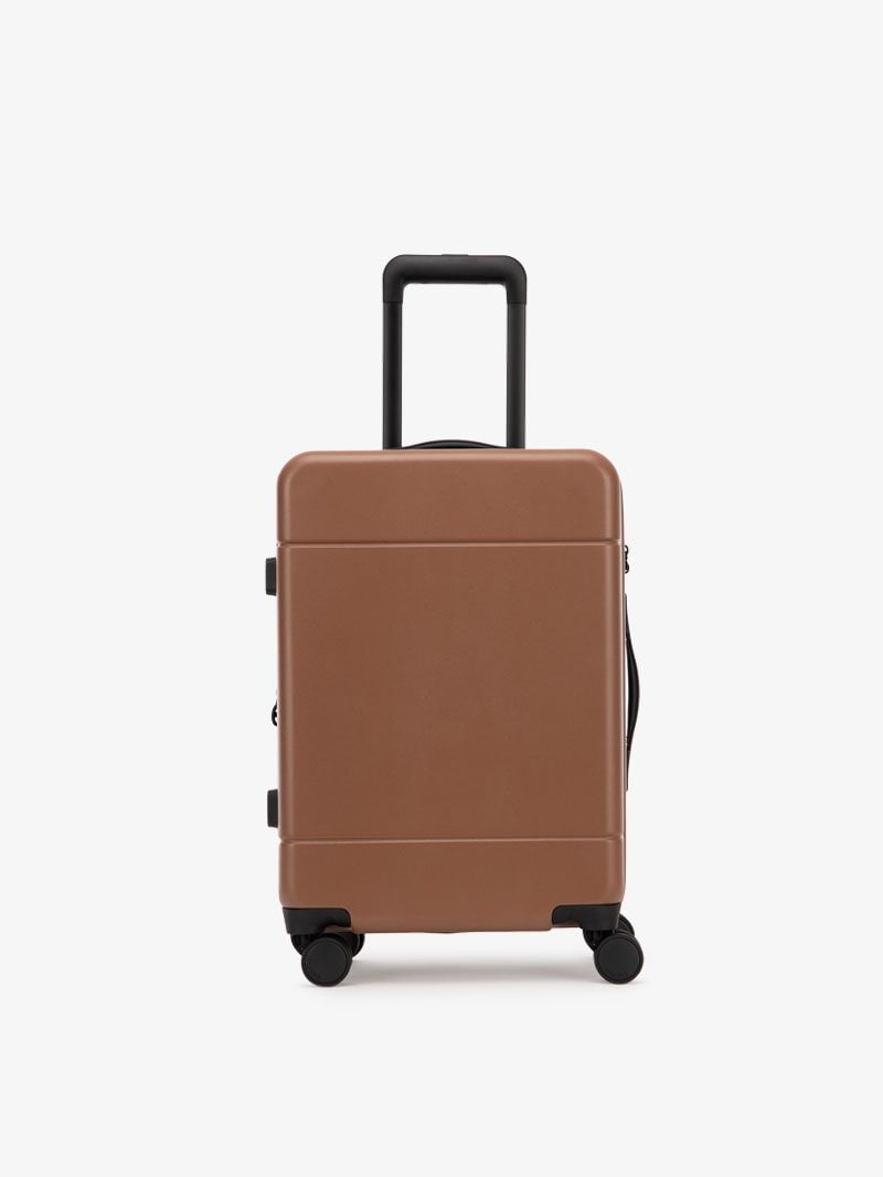 CALPAK Hue hard shell rolling carry-on luggage in brown hazel color